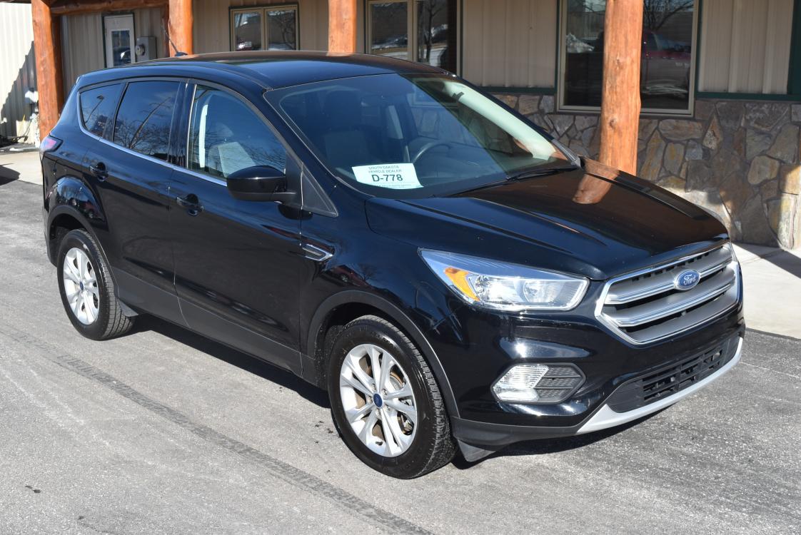 2017 Black Ford Escape SE (1FMCU9GD7HU) with an 1.5L Ecoboost engine, 6 Speed Automatic W/ Selectshift transmission, located at 1600 E Hwy 44, Rapid City, SD, 57703, (605) 716-7878, 44.070232, -103.171410 - Photo #0