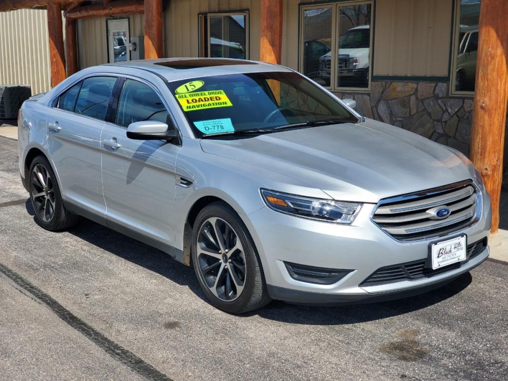 2015 Silver Ford Taurus SEL (1FAHP2H89FG) with an 3.5L V6 TI-VCT engine, 6-Speed Selectshift Automatic transmission, located at 1600 E Hwy 44, Rapid City, SD, 57703, (605) 716-7878, 44.070232, -103.171410 - Photo #0