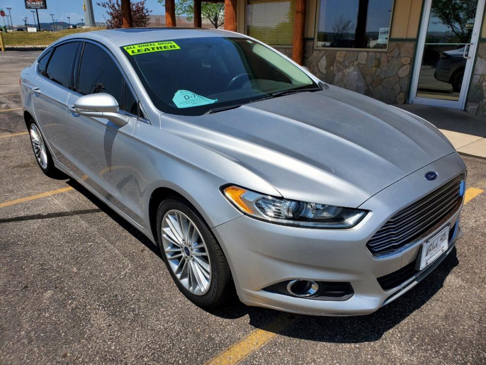 2016 Silver Ford Fusion SE (3FA6P0T9XGR) with an 2.0L 4 Cyl Ecoboost engine, 6-Speed Automatic W/ Selectshift transmission, located at 1600 E Hwy 44, Rapid City, SD, 57703, (605) 716-7878, 44.070232, -103.171410 - Photo #0