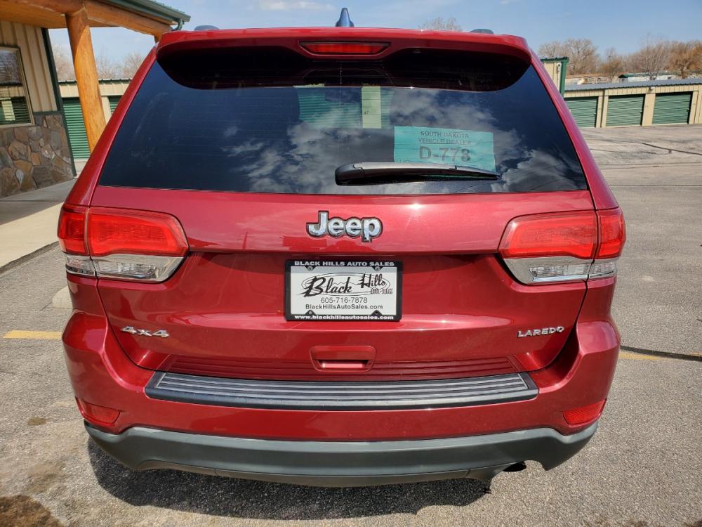 2015 Red /Black Jeep Grand Cherokee Laredo (1C4RJFAG7FC) with an 3.6L V6 24Valve Variable Valve Timing engine, 8_Speed Automatic transmission, located at 1600 E Hwy 44, Rapid City, SD, 57703, (605) 716-7878, 44.070232, -103.171410 - Photo #6