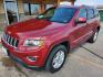 2015 Red /Black Jeep Grand Cherokee Laredo (1C4RJFAG7FC) with an 3.6L V6 24Valve Variable Valve Timing engine, 8_Speed Automatic transmission, located at 1600 E Hwy 44, Rapid City, SD, 57703, (605) 716-7878, 44.070232, -103.171410 - Photo #2