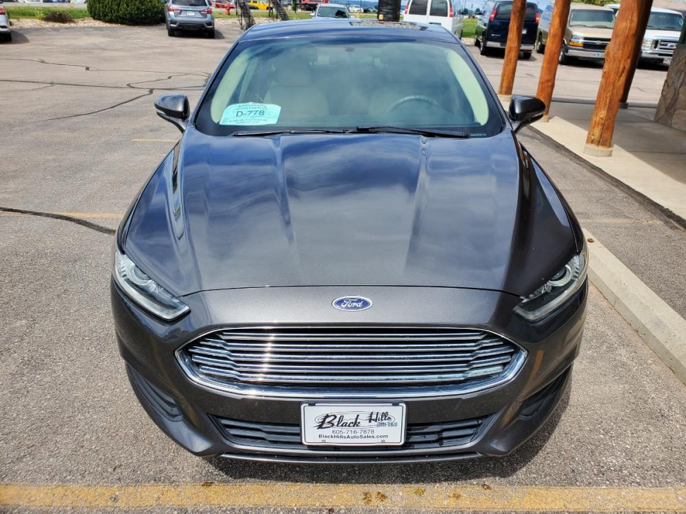 2016 Gray Ford Fusion SE (3FA6P0H73GR) with an 2.5L 4 Cyl engine, 6-Speed Automatic W/ Selectshift transmission, located at 1600 E Hwy 44, Rapid City, SD, 57703, (605) 716-7878, 44.070232, -103.171410 - Photo #1