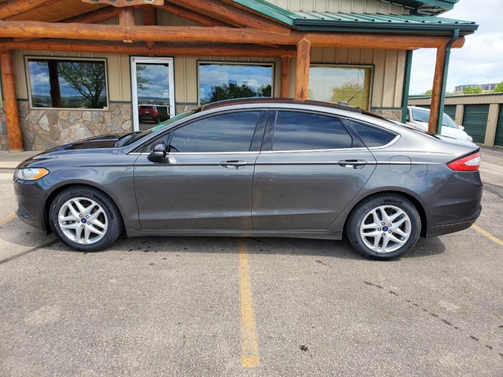 2016 Gray Ford Fusion SE (3FA6P0H73GR) with an 2.5L 4 Cyl engine, 6-Speed Automatic W/ Selectshift transmission, located at 1600 E Hwy 44, Rapid City, SD, 57703, (605) 716-7878, 44.070232, -103.171410 - Photo #3