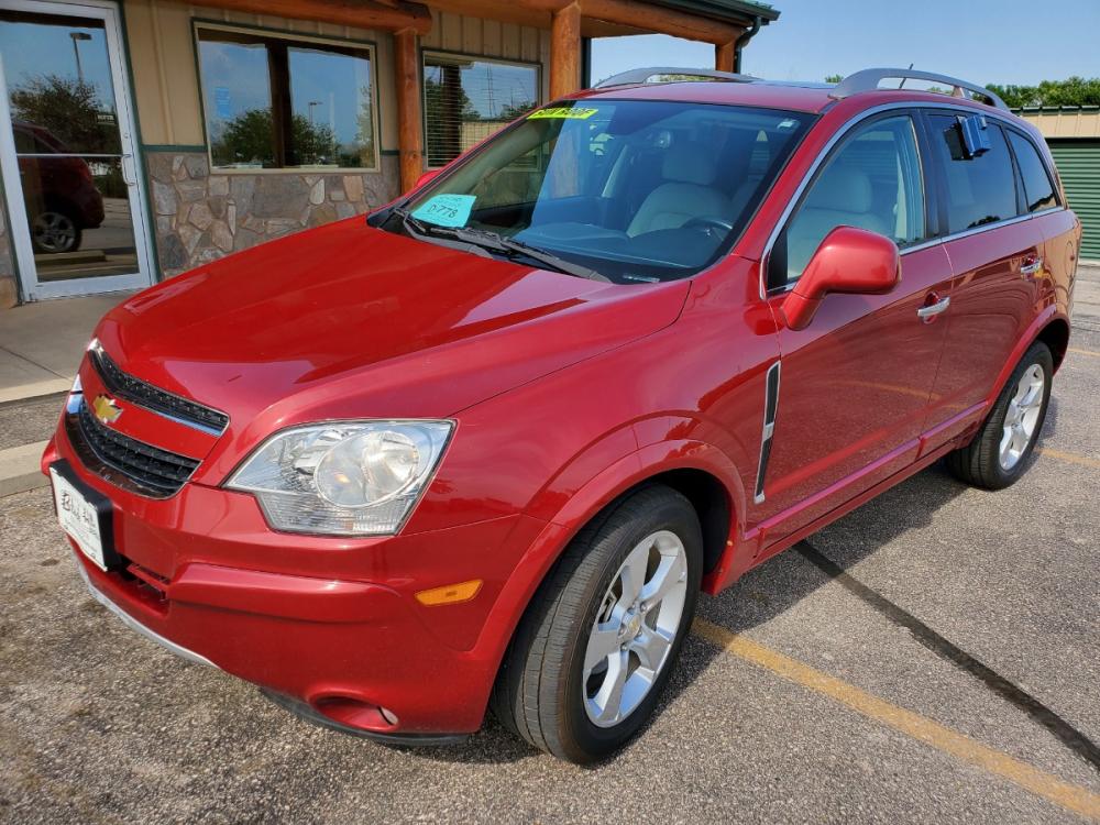 2014 Red /Black & Beige Chevrolet Captiva Sport LTZ (3GNAL4EK0ES) with an 2.4L 4Cyl engine, 6-Speed Automatic transmission, located at 1600 E Hwy 44, Rapid City, SD, 57703, (605) 716-7878, 44.070232, -103.171410 - Photo #2