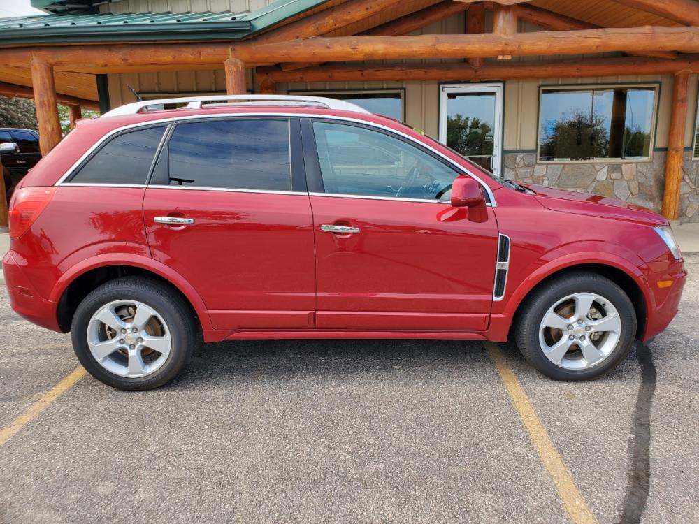 2014 Red /Black & Beige Chevrolet Captiva Sport LTZ (3GNAL4EK0ES) with an 2.4L 4Cyl engine, 6-Speed Automatic transmission, located at 1600 E Hwy 44, Rapid City, SD, 57703, (605) 716-7878, 44.070232, -103.171410 - Photo #4