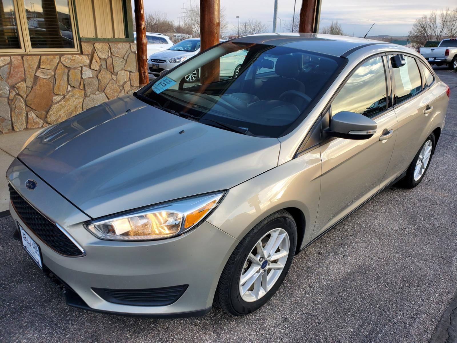 2016 Tan /Black Ford Focus SE (1FADP3F23GL) with an 2.0L 4Cyl GDI TI-VCT engine, 6-Speed Powershift Automatic transmission, located at 1600 E Hwy 44, Rapid City, SD, 57703, (605) 716-7878, 44.070232, -103.171410 - Photo #2
