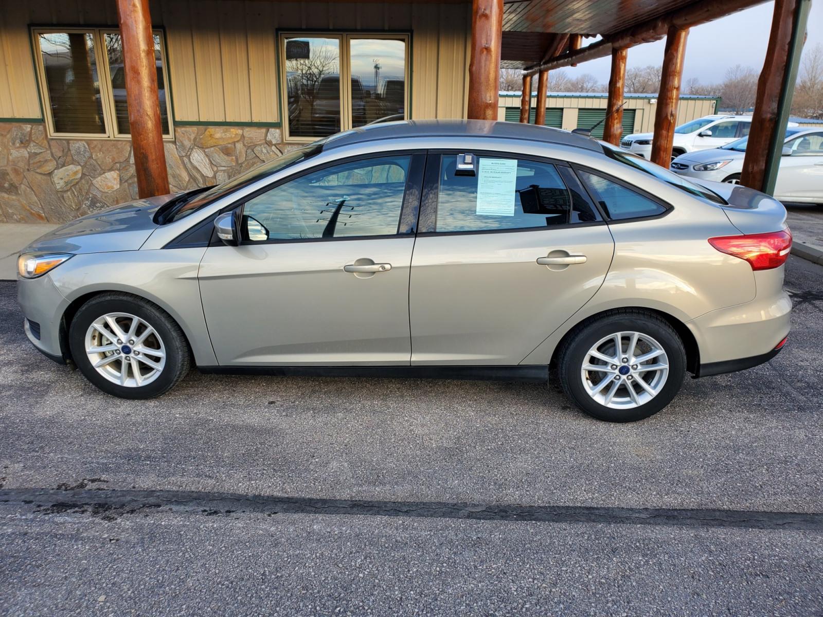 2016 Tan /Black Ford Focus SE (1FADP3F23GL) with an 2.0L 4Cyl GDI TI-VCT engine, 6-Speed Powershift Automatic transmission, located at 1600 E Hwy 44, Rapid City, SD, 57703, (605) 716-7878, 44.070232, -103.171410 - Photo #3