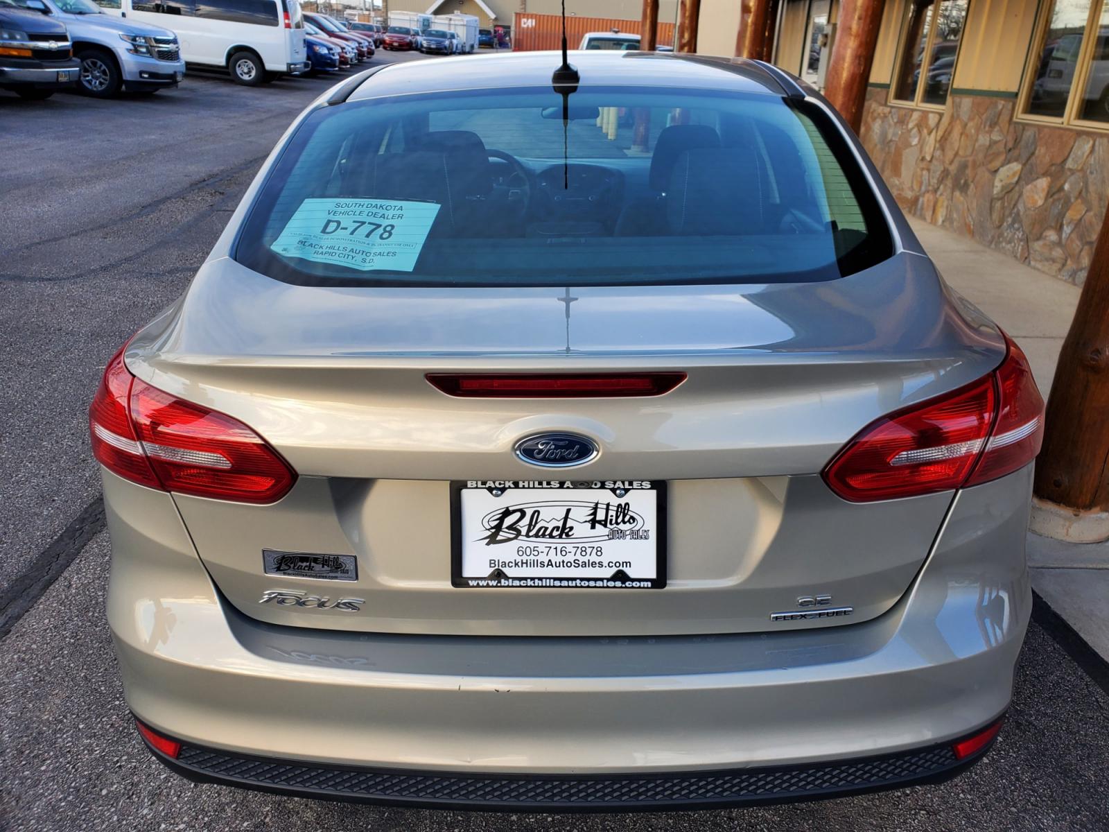2016 Tan /Black Ford Focus SE (1FADP3F23GL) with an 2.0L 4Cyl GDI TI-VCT engine, 6-Speed Powershift Automatic transmission, located at 1600 E Hwy 44, Rapid City, SD, 57703, (605) 716-7878, 44.070232, -103.171410 - Photo #6
