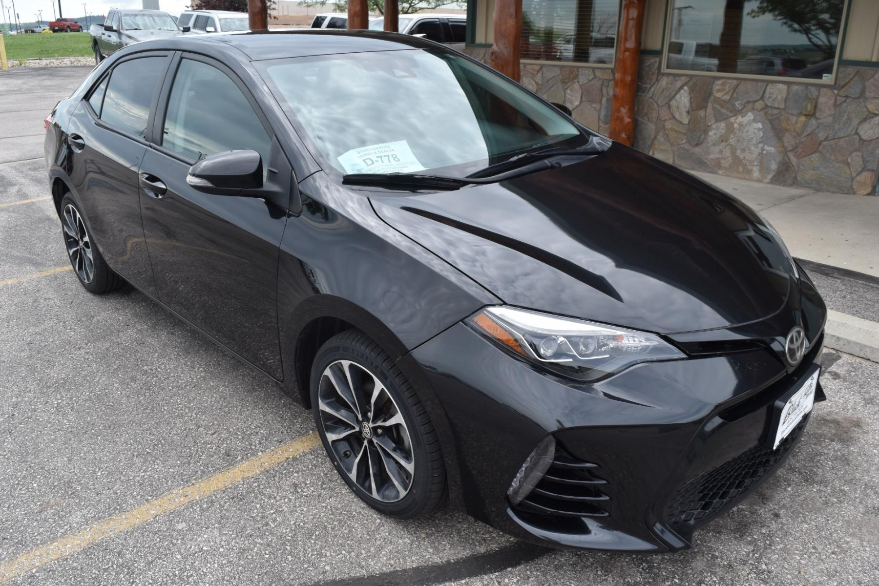 2017 Black Toyota Corolla SE (2T1BURHE5HC) with an 1.8L 4 Cyl engine, AV-S7 Automatic transmission, located at 1600 E Hwy 44, Rapid City, SD, 57703, (605) 716-7878, 44.070232, -103.171410 - Photo #0