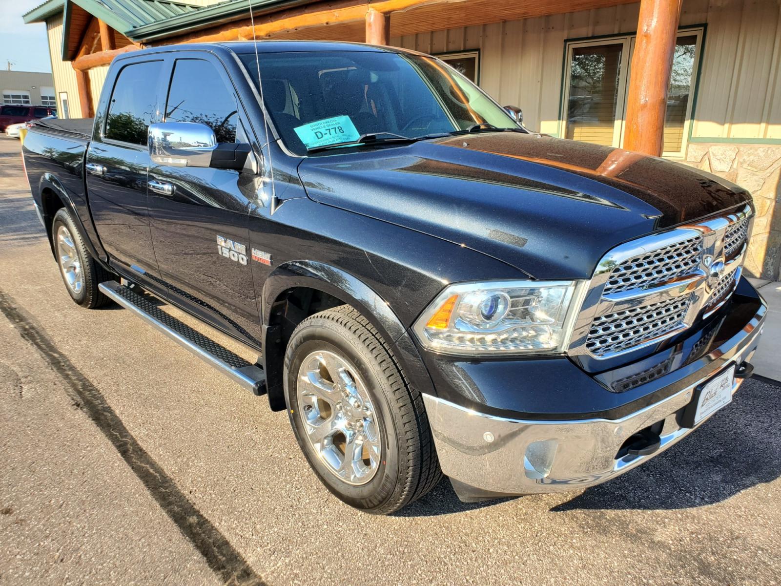 2016 Black /Black Ram 1500 Laramie (1C6RR7NT3GS) with an 5.7L V-8 Hemi engine, 8-Speed Automatic transmission, located at 1600 E Hwy 44, Rapid City, SD, 57703, (605) 716-7878, 44.070232, -103.171410 - Photo #0