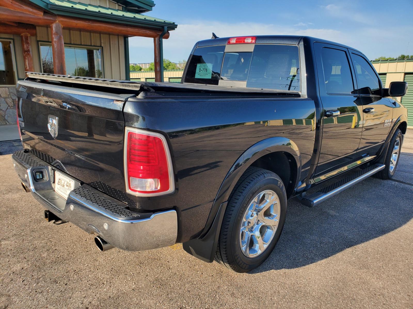 2016 Black /Black Ram 1500 Laramie (1C6RR7NT3GS) with an 5.7L V-8 Hemi engine, 8-Speed Automatic transmission, located at 1600 E Hwy 44, Rapid City, SD, 57703, (605) 716-7878, 44.070232, -103.171410 - Photo #7