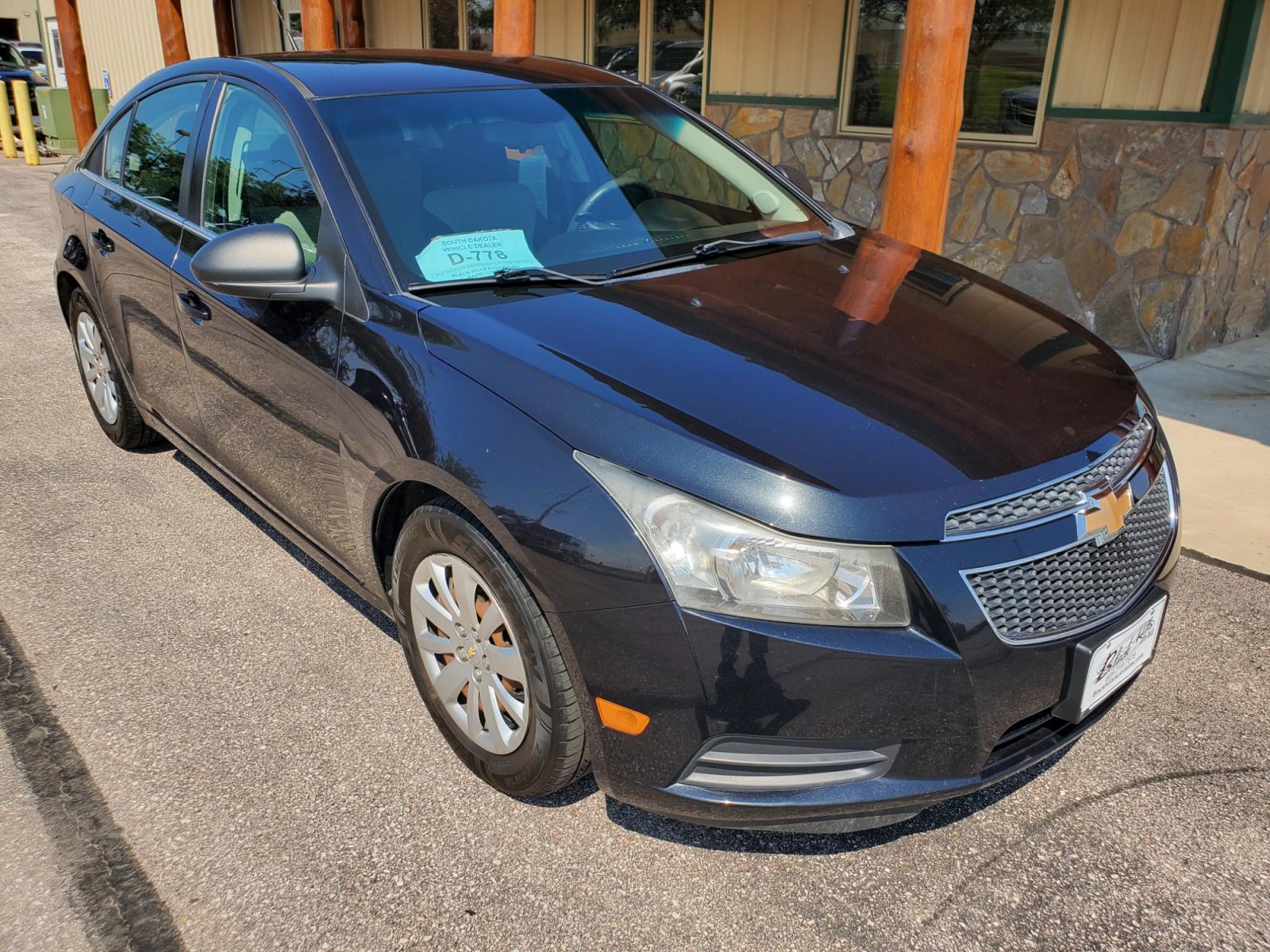 2011 Black /Gray Chevrolet Cruze LS (1G1PD5SHIB7) with an 1.8L Ecotec 4 Cyl Variable Valve Timing DOHC Sequential MFI engine, 6-Speed Manual w/ Overdrive transmission, located at 1600 E Hwy 44, Rapid City, SD, 57703, (605) 716-7878, 44.070232, -103.171410 - Photo #0