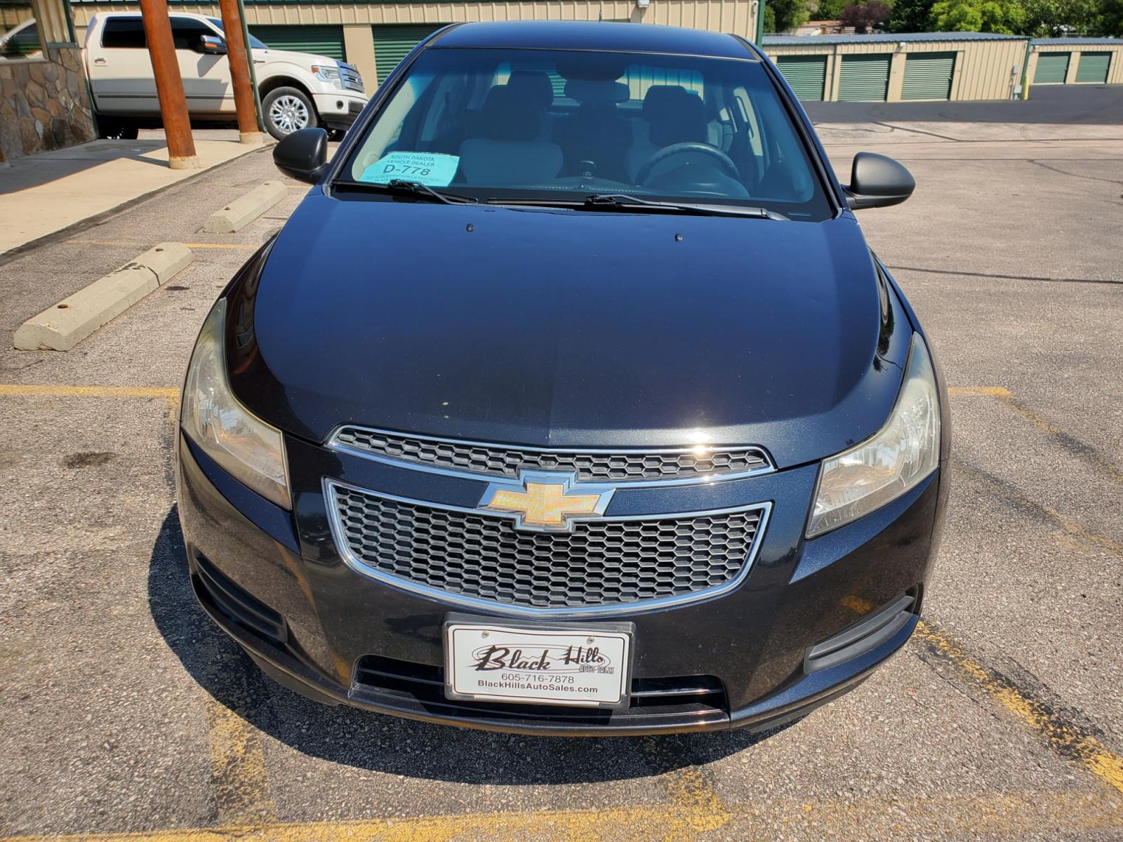 2011 Black /Gray Chevrolet Cruze LS (1G1PD5SHIB7) with an 1.8L Ecotec 4 Cyl Variable Valve Timing DOHC Sequential MFI engine, 6-Speed Manual w/ Overdrive transmission, located at 1600 E Hwy 44, Rapid City, SD, 57703, (605) 716-7878, 44.070232, -103.171410 - Photo #1