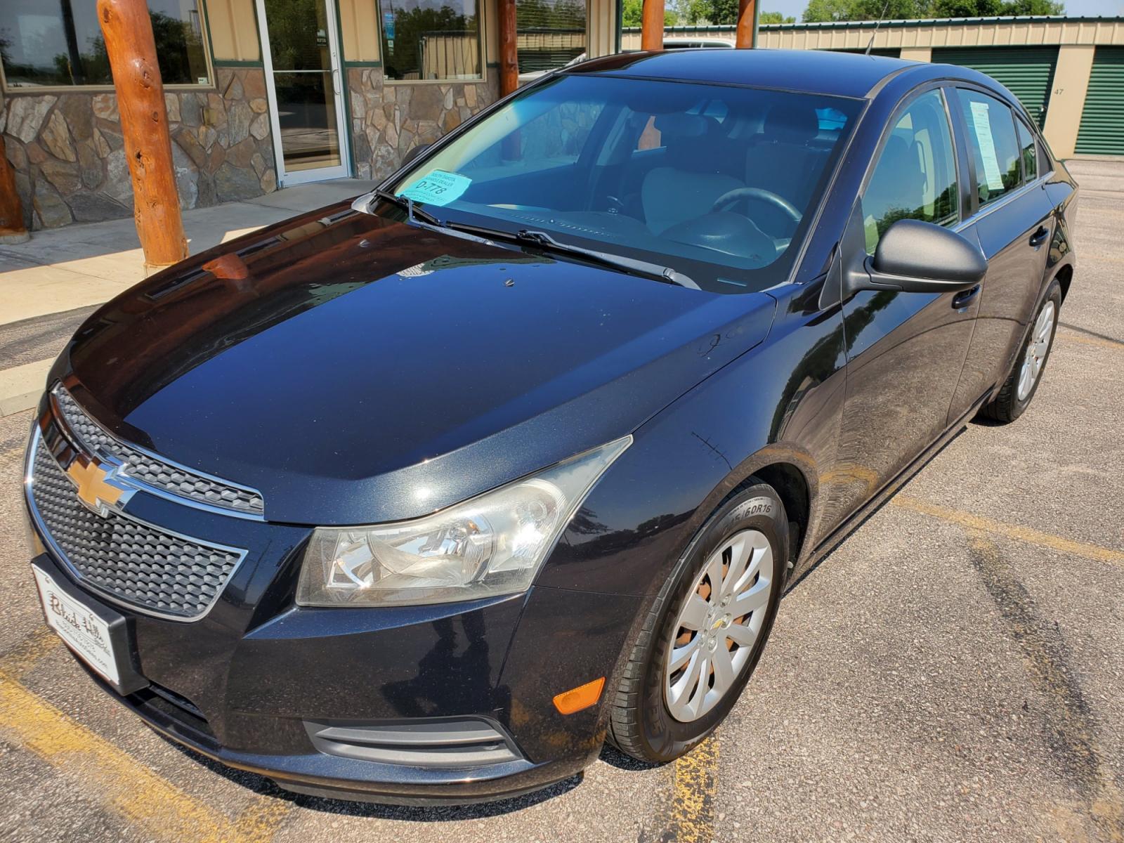 2011 Black /Gray Chevrolet Cruze LS (1G1PD5SHIB7) with an 1.8L Ecotec 4 Cyl Variable Valve Timing DOHC Sequential MFI engine, 6-Speed Manual w/ Overdrive transmission, located at 1600 E Hwy 44, Rapid City, SD, 57703, (605) 716-7878, 44.070232, -103.171410 - Photo #2
