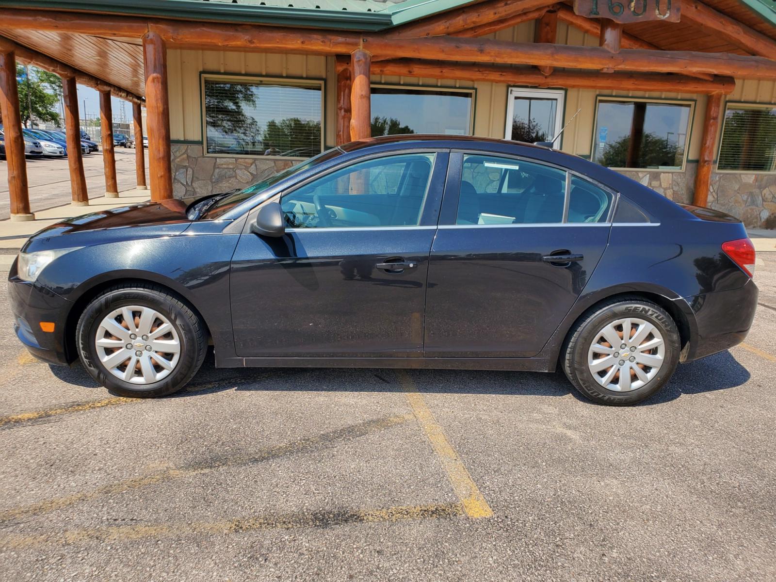 2011 Black /Gray Chevrolet Cruze LS (1G1PD5SHIB7) with an 1.8L Ecotec 4 Cyl Variable Valve Timing DOHC Sequential MFI engine, 6-Speed Manual w/ Overdrive transmission, located at 1600 E Hwy 44, Rapid City, SD, 57703, (605) 716-7878, 44.070232, -103.171410 - Photo #3