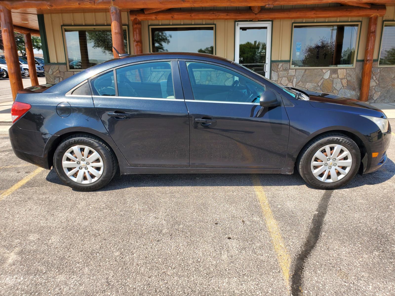 2011 Black /Gray Chevrolet Cruze LS (1G1PD5SHIB7) with an 1.8L Ecotec 4 Cyl Variable Valve Timing DOHC Sequential MFI engine, 6-Speed Manual w/ Overdrive transmission, located at 1600 E Hwy 44, Rapid City, SD, 57703, (605) 716-7878, 44.070232, -103.171410 - Photo #4
