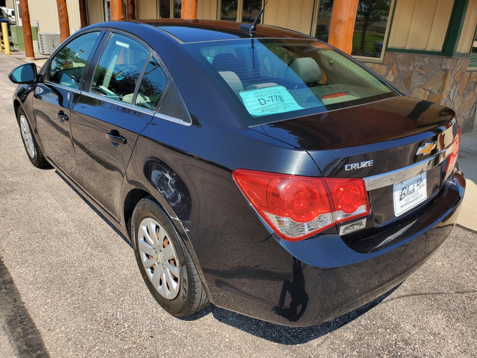 2011 Black /Gray Chevrolet Cruze LS (1G1PD5SHIB7) with an 1.8L Ecotec 4 Cyl Variable Valve Timing DOHC Sequential MFI engine, 6-Speed Manual w/ Overdrive transmission, located at 1600 E Hwy 44, Rapid City, SD, 57703, (605) 716-7878, 44.070232, -103.171410 - Photo #5
