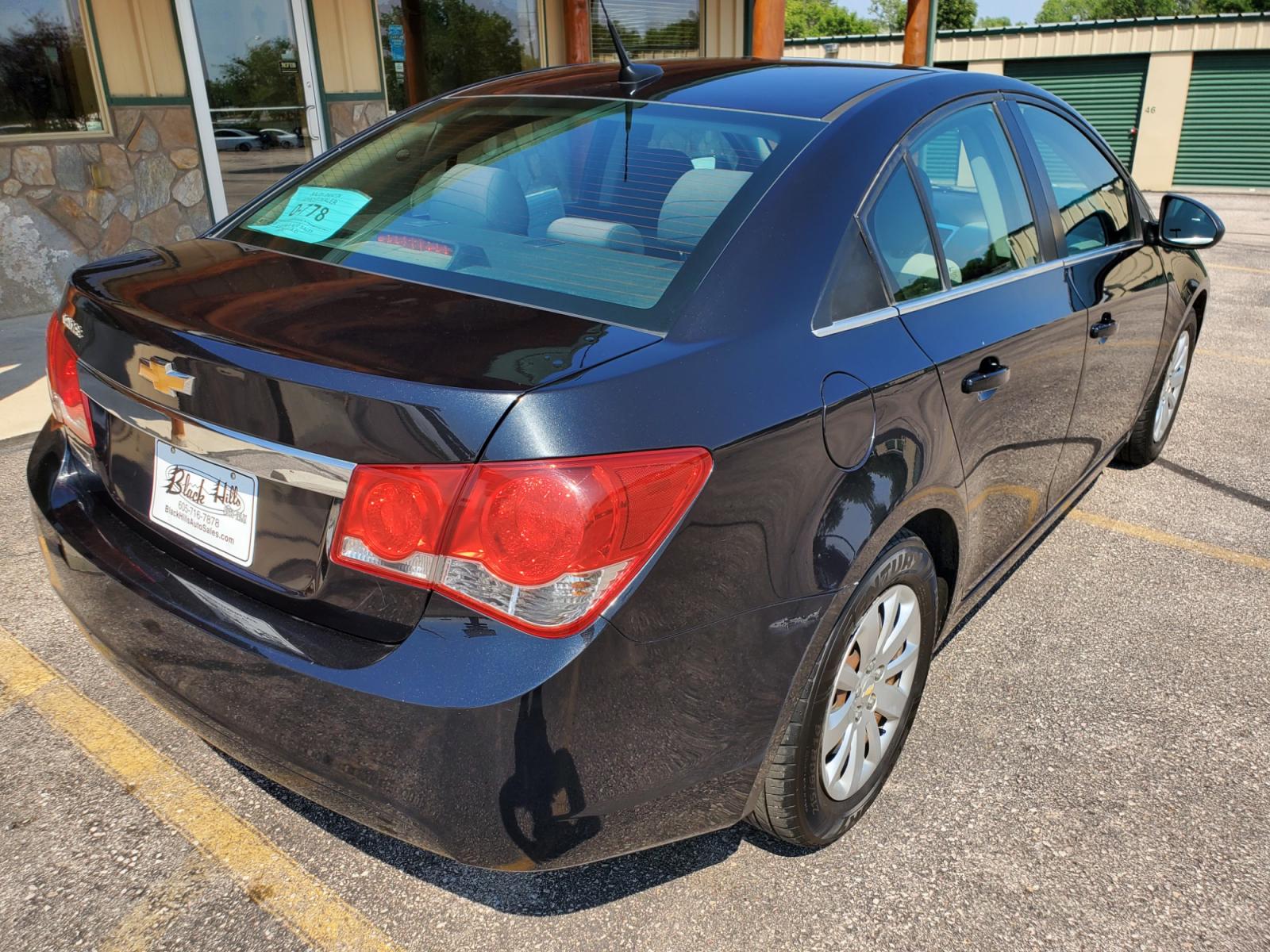 2011 Black /Gray Chevrolet Cruze LS (1G1PD5SHIB7) with an 1.8L Ecotec 4 Cyl Variable Valve Timing DOHC Sequential MFI engine, 6-Speed Manual w/ Overdrive transmission, located at 1600 E Hwy 44, Rapid City, SD, 57703, (605) 716-7878, 44.070232, -103.171410 - Photo #7
