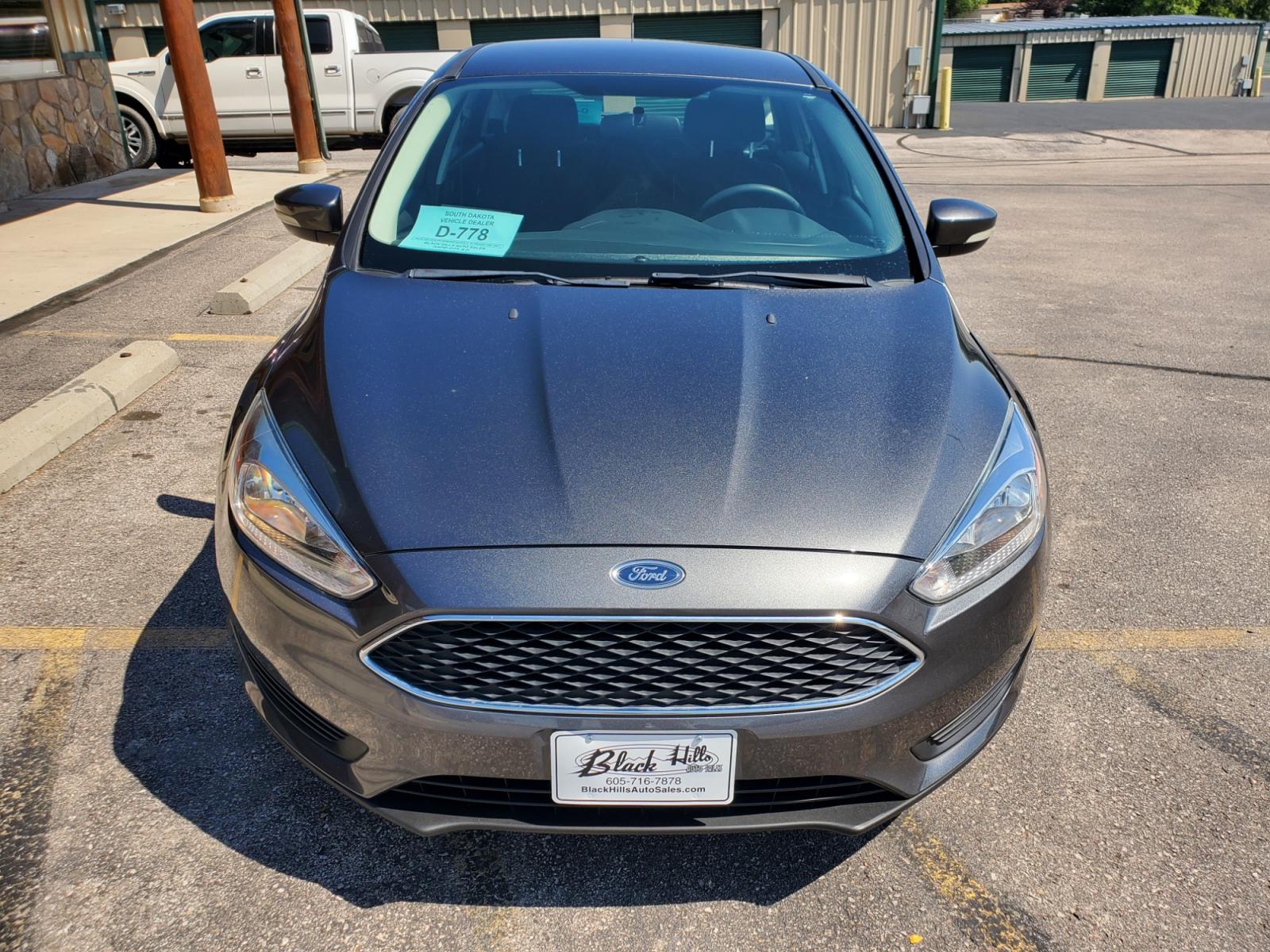 2017 Gray /Gray Ford Focus SE (1FADP3K29HL) with an 2.0L 4Cyl GDI TI-VCT engine, 6-Speed Powershift Automatic transmission, located at 1600 E Hwy 44, Rapid City, SD, 57703, (605) 716-7878, 44.070232, -103.171410 - Photo #1