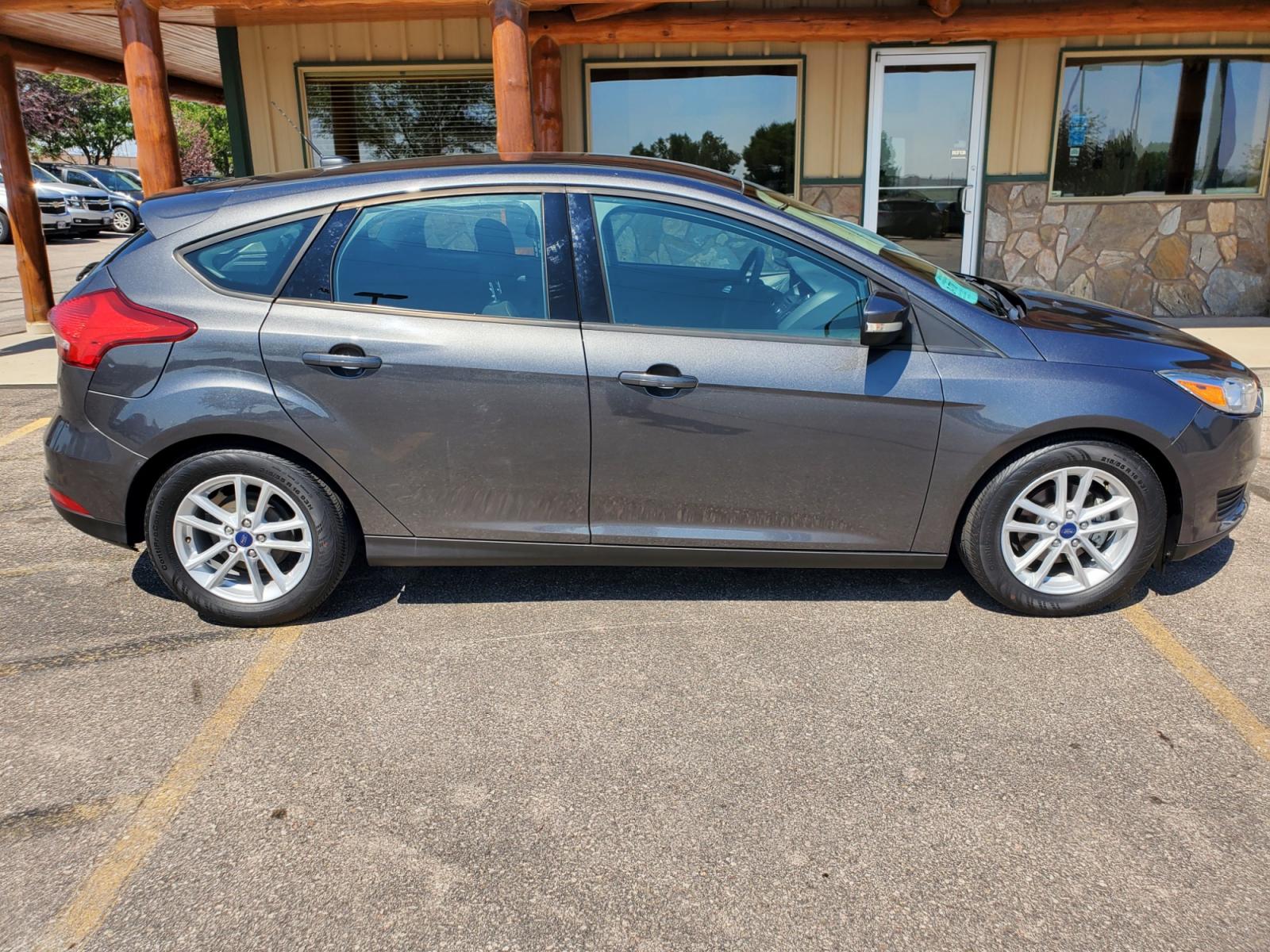 2017 Gray /Gray Ford Focus SE (1FADP3K29HL) with an 2.0L 4Cyl GDI TI-VCT engine, 6-Speed Powershift Automatic transmission, located at 1600 E Hwy 44, Rapid City, SD, 57703, (605) 716-7878, 44.070232, -103.171410 - Photo #4