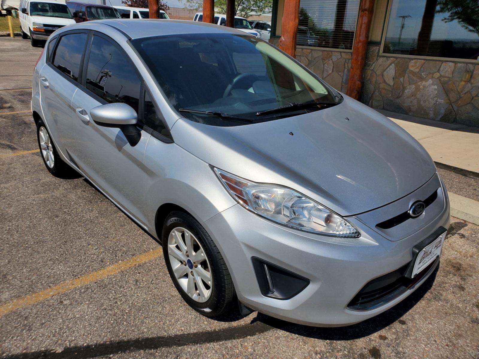 2012 Silver /Black Ford Fiesta SE (3FADP4EJ5CM) with an 1.6l 4Cyl TI-VCT engine, 6-Speed Poweshift transmission, located at 1600 E Hwy 44, Rapid City, SD, 57703, (605) 716-7878, 44.070232, -103.171410 - Photo #0