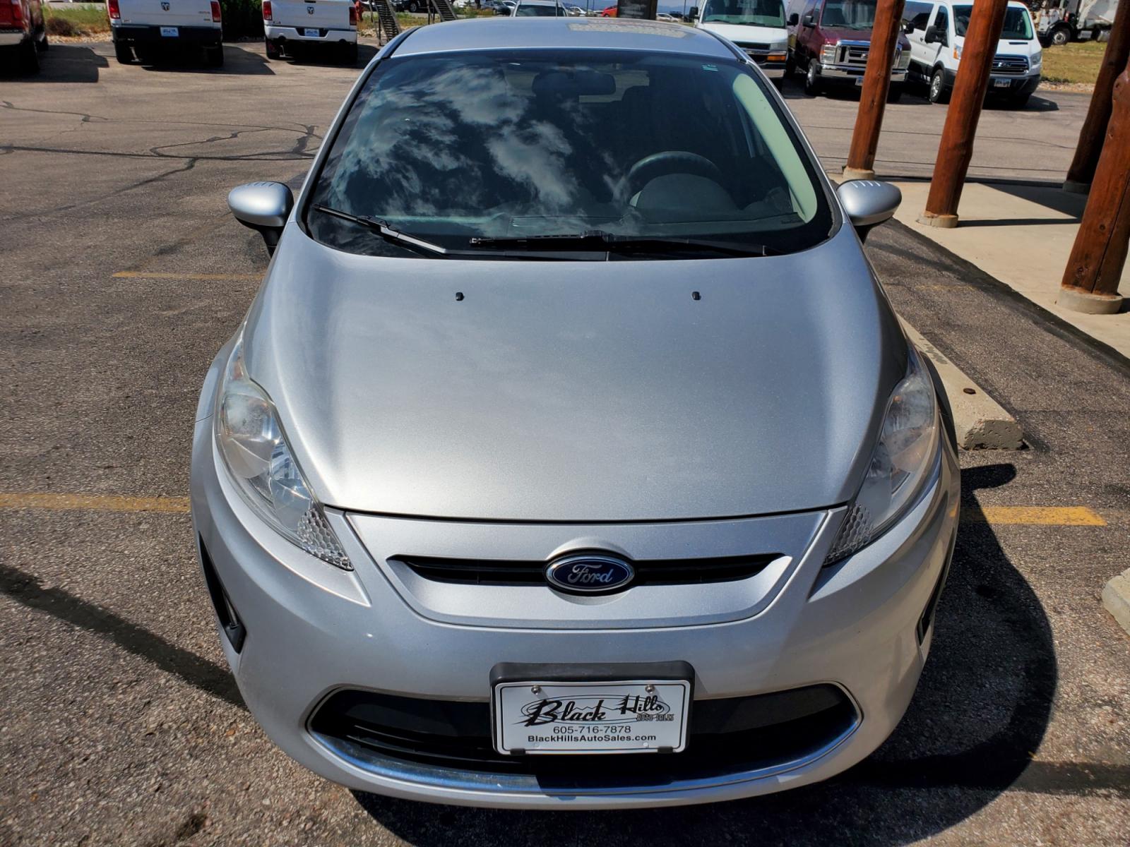 2012 Silver /Black Ford Fiesta SE (3FADP4EJ5CM) with an 1.6l 4Cyl TI-VCT engine, 6-Speed Poweshift transmission, located at 1600 E Hwy 44, Rapid City, SD, 57703, (605) 716-7878, 44.070232, -103.171410 - Photo #1
