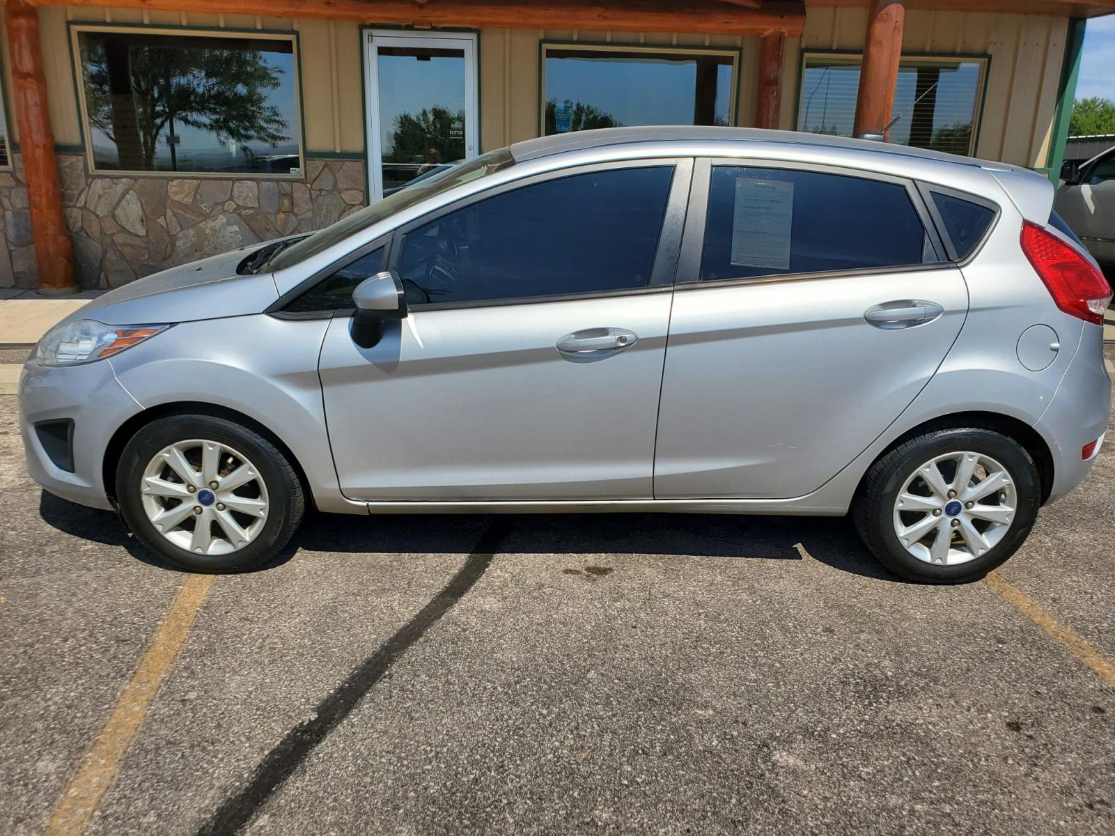2012 Silver /Black Ford Fiesta SE (3FADP4EJ5CM) with an 1.6l 4Cyl TI-VCT engine, 6-Speed Poweshift transmission, located at 1600 E Hwy 44, Rapid City, SD, 57703, (605) 716-7878, 44.070232, -103.171410 - Photo #4
