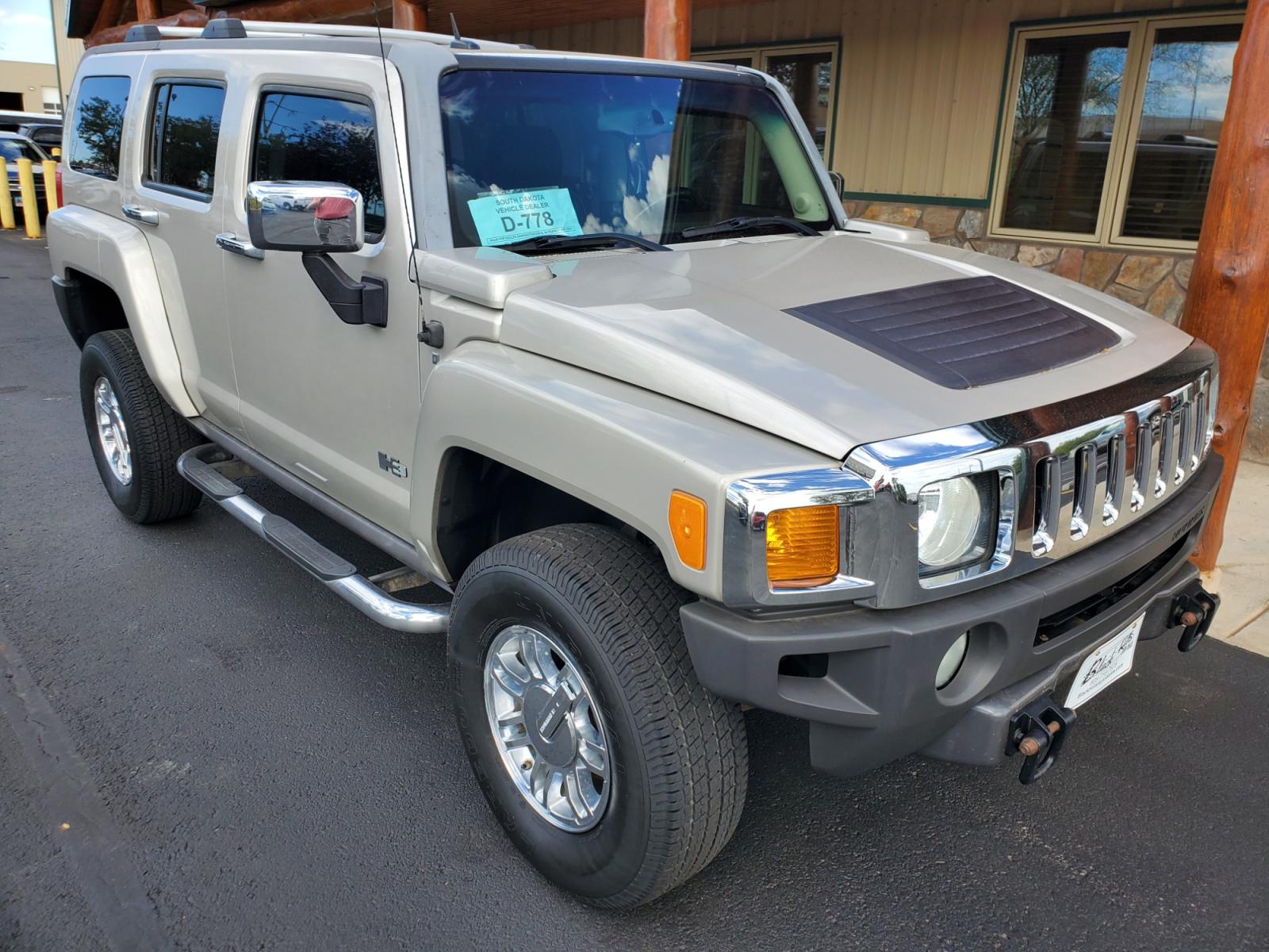 2007 Tan Hummer H3 (5GTDN13E778) with an 3.7L DOHC 5-CYLINDER MFI engine, 4-Speed Automatic, Electronically Controlled With Overdrive transmission, located at 1600 E Hwy 44, Rapid City, SD, 57703, (605) 716-7878, 44.070232, -103.171410 - Photo #0