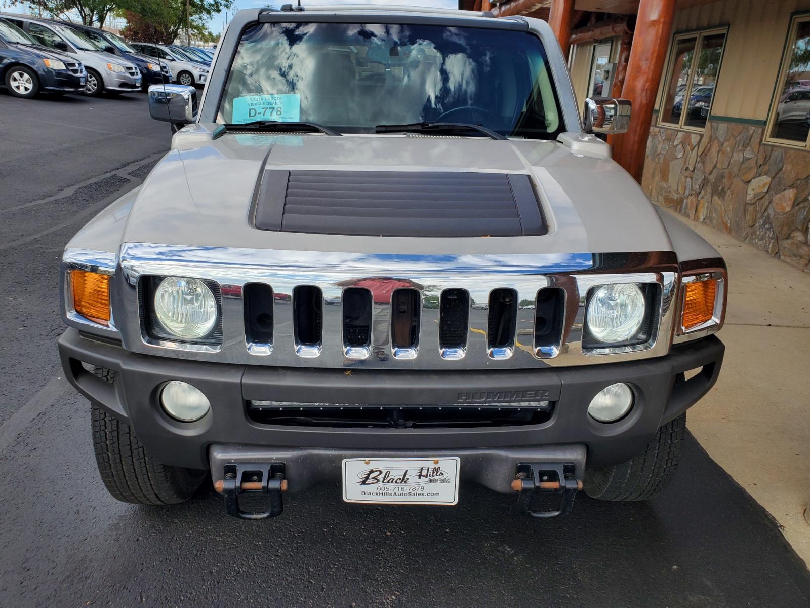 2007 Tan Hummer H3 (5GTDN13E778) with an 3.7L DOHC 5-CYLINDER MFI engine, 4-Speed Automatic, Electronically Controlled With Overdrive transmission, located at 1600 E Hwy 44, Rapid City, SD, 57703, (605) 716-7878, 44.070232, -103.171410 - Photo #1