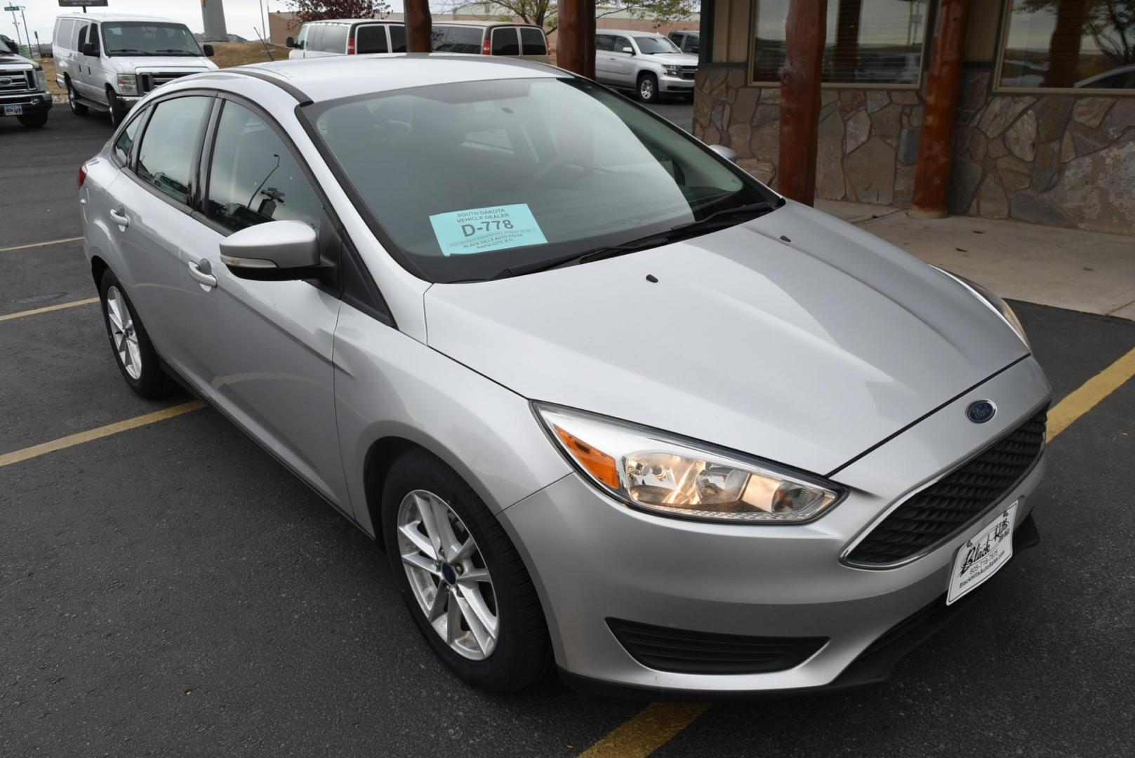 2016 Silver Ford Focus SE (1FADP3F21GL) with an 2.0L I-4 GDI TI-VCT engine, 6-Speed Powershift Automatic transmission, located at 1600 E Hwy 44, Rapid City, SD, 57703, (605) 716-7878, 44.070232, -103.171410 - Photo#0