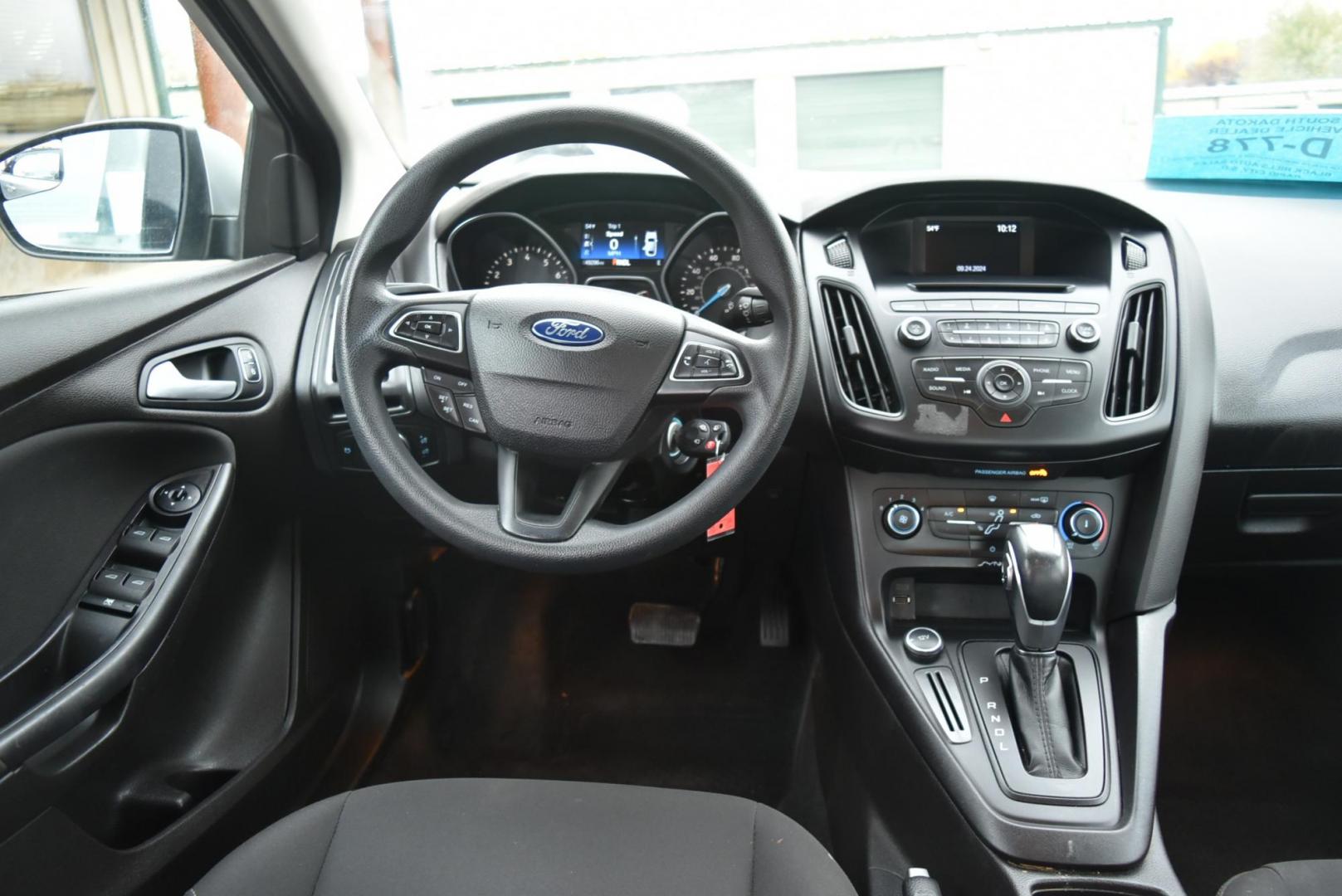 2016 Silver Ford Focus SE (1FADP3F21GL) with an 2.0L I-4 GDI TI-VCT engine, 6-Speed Powershift Automatic transmission, located at 1600 E Hwy 44, Rapid City, SD, 57703, (605) 716-7878, 44.070232, -103.171410 - Photo#12