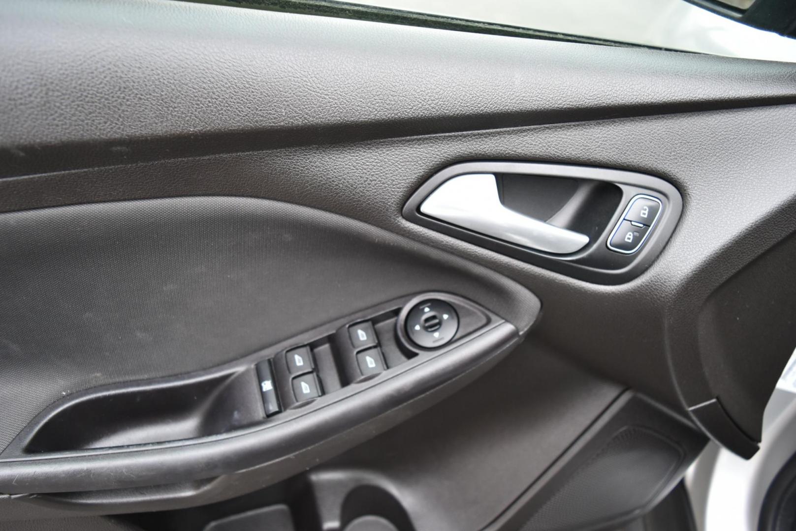 2016 Silver Ford Focus SE (1FADP3F21GL) with an 2.0L I-4 GDI TI-VCT engine, 6-Speed Powershift Automatic transmission, located at 1600 E Hwy 44, Rapid City, SD, 57703, (605) 716-7878, 44.070232, -103.171410 - Photo#14