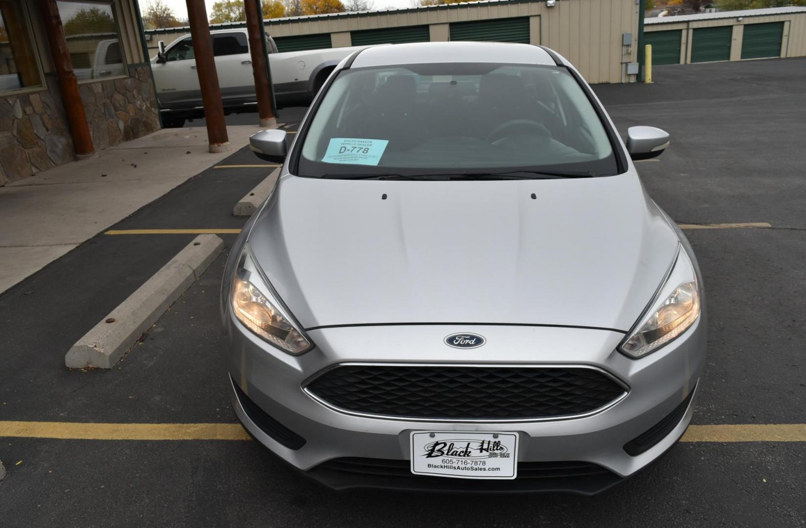 2016 Silver Ford Focus SE (1FADP3F21GL) with an 2.0L I-4 GDI TI-VCT engine, 6-Speed Powershift Automatic transmission, located at 1600 E Hwy 44, Rapid City, SD, 57703, (605) 716-7878, 44.070232, -103.171410 - Photo#1