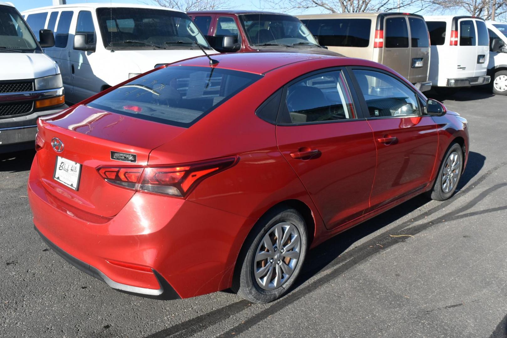 2018 Red /Gray Hyundai Accent SE (3KPC24A36JE) with an 1.6L 4 Cyl engine, 6-Speed Automatic transmission, located at 1600 E Hwy 44, Rapid City, SD, 57703, (605) 716-7878, 44.070232, -103.171410 - Photo#5