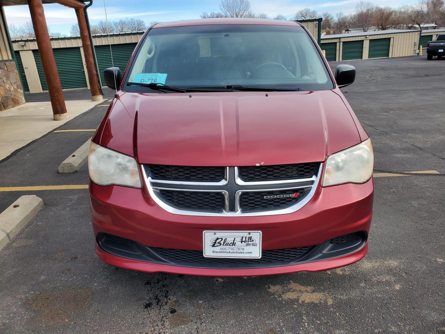 2014 Red /Black Dodge Grand Caravan SE (2C4RDGBG5ER) with an 3.6L V6 24V VVT engine, 6-Speed Automatic transmission, located at 1600 E Hwy 44, Rapid City, SD, 57703, (605) 716-7878, 44.070232, -103.171410 - Photo#1