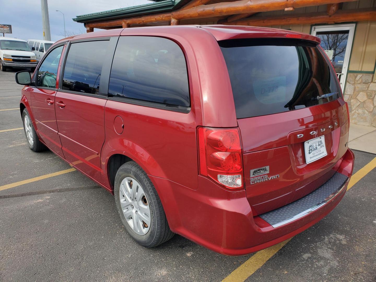 2014 Red /Black Dodge Grand Caravan SE (2C4RDGBG5ER) with an 3.6L V6 24V VVT engine, 6-Speed Automatic transmission, located at 1600 E Hwy 44, Rapid City, SD, 57703, (605) 716-7878, 44.070232, -103.171410 - Photo#4