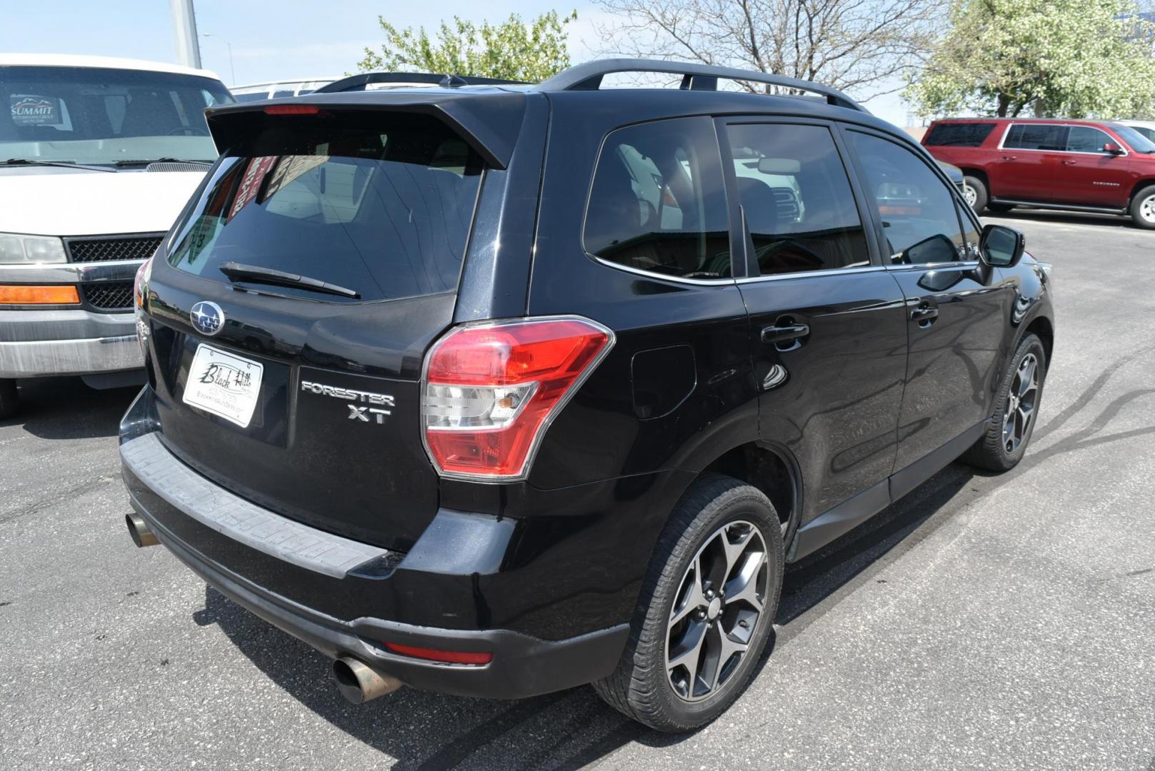 2014 Black /Black Subaru Forester XT Premium (JF2SJGDC2EH) with an 2.0 L Intercooled Turbo Premium Unleaded H-4 engine, 8-speed CVT w/OD transmission, located at 1600 E Hwy 44, Rapid City, SD, 57703, (605) 716-7878, 44.070232, -103.171410 - Photo#7