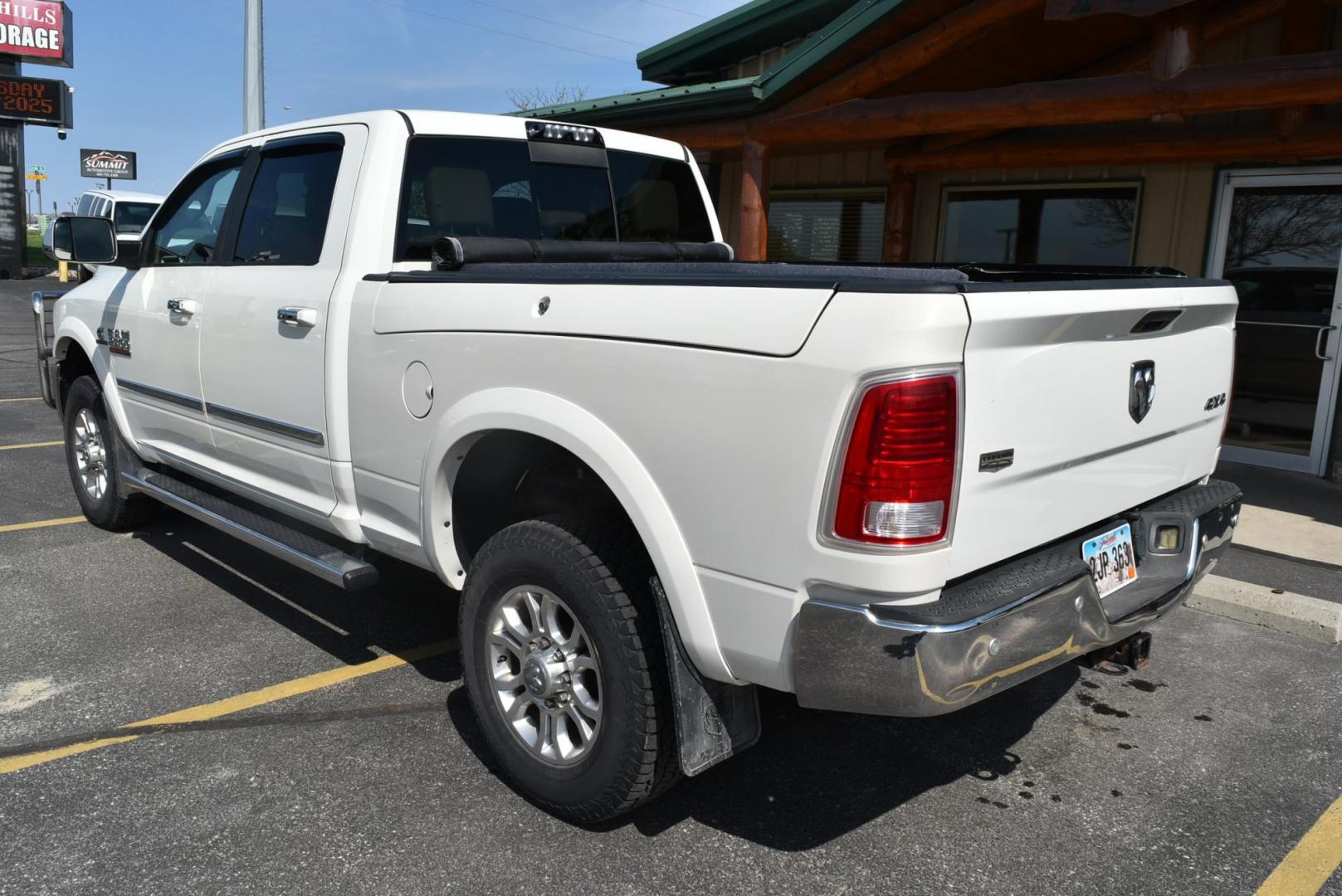 2016 White /Lt Brown Ram 2500 Laramie (3C6UR5FL2GG) with an 6.7L I6 CUMMINS TURBO DIESEL engine, 6-Speed Automatic transmission, located at 1600 E Hwy 44, Rapid City, SD, 57703, (605) 716-7878, 44.070232, -103.171410 - Photo#5