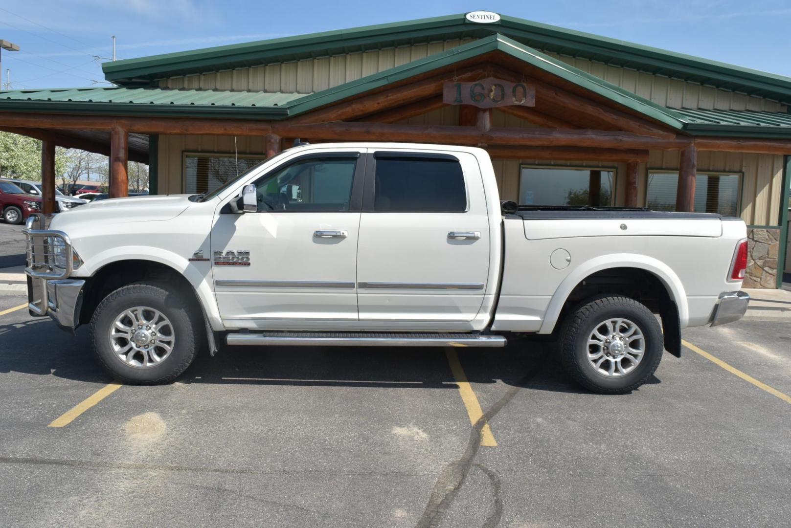 2016 White /Lt Brown Ram 2500 Laramie (3C6UR5FL2GG) with an 6.7L I6 CUMMINS TURBO DIESEL engine, 6-Speed Automatic transmission, located at 1600 E Hwy 44, Rapid City, SD, 57703, (605) 716-7878, 44.070232, -103.171410 - Photo#3