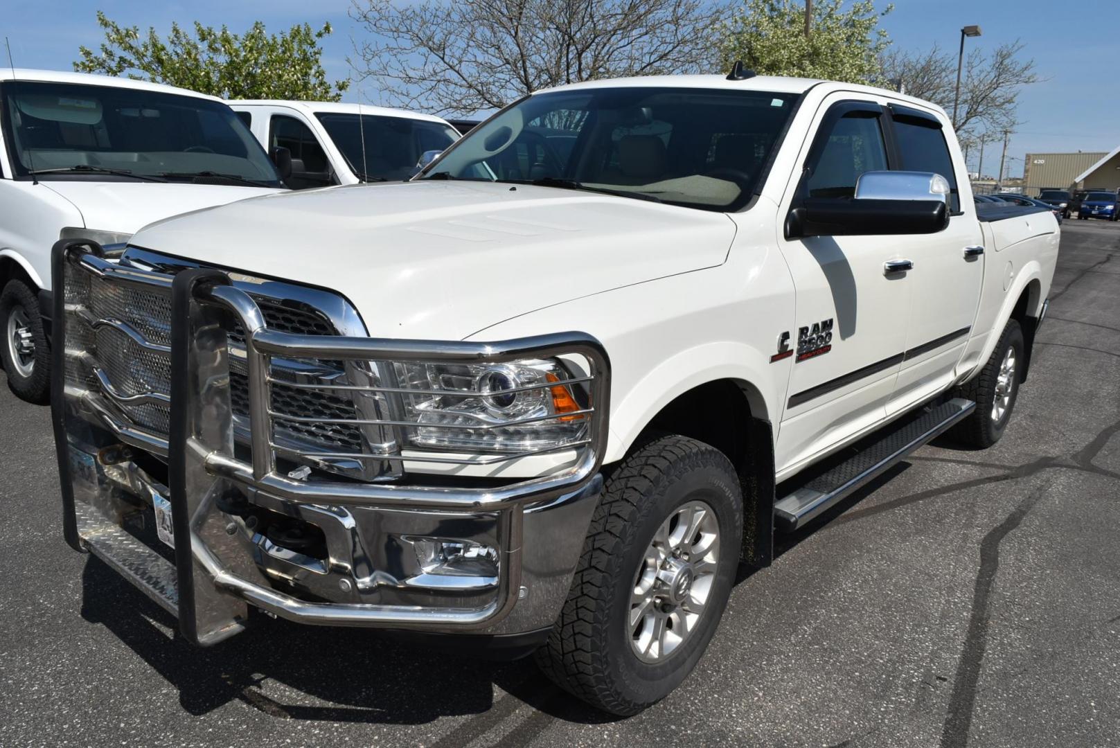 2016 White /Lt Brown Ram 2500 Laramie (3C6UR5FL2GG) with an 6.7L I6 CUMMINS TURBO DIESEL engine, 6-Speed Automatic transmission, located at 1600 E Hwy 44, Rapid City, SD, 57703, (605) 716-7878, 44.070232, -103.171410 - Photo#2