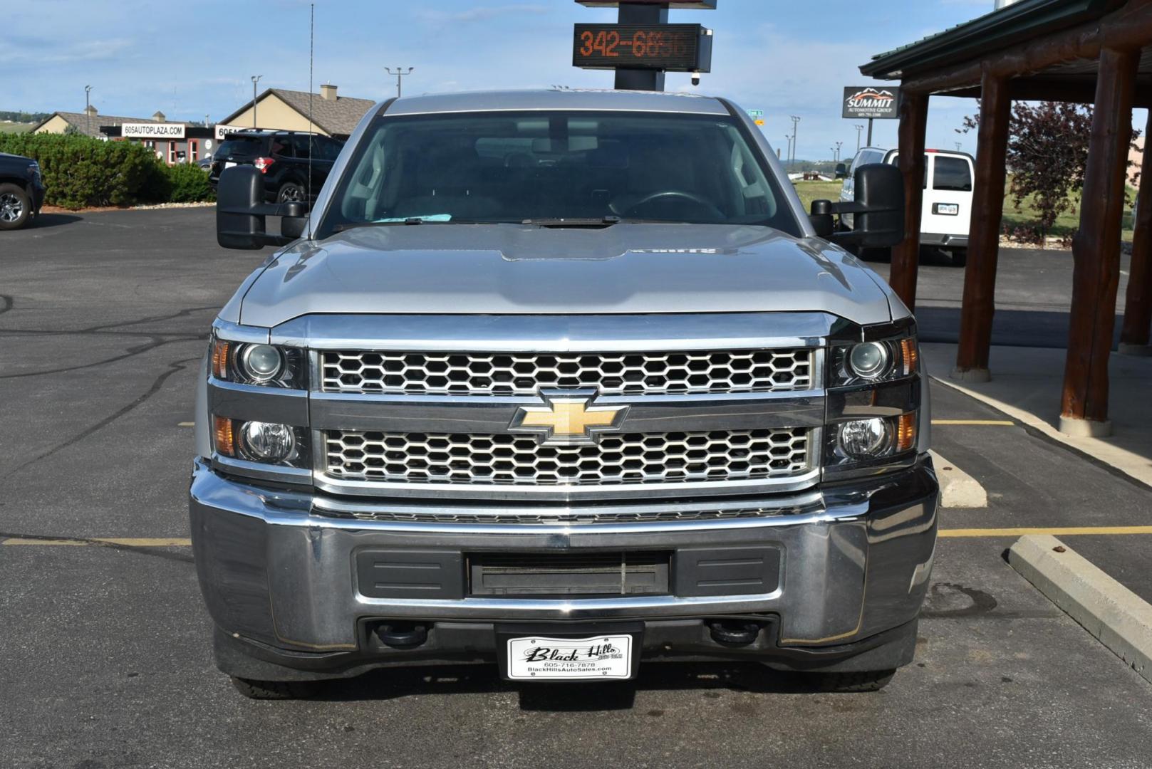 2019 Silver /gray Chevrolet Silverado 2500HD Work Truck Double Cab 4WD (2GC2KREG7K1) with an VORTEC 6.0L VARIABLE VALVE TIMING V8 SFI engine, 6-Speed Automatic, Heavy-Duty, Electronically Controlled transmission, located at 1600 E Hwy 44, Rapid City, SD, 57703, (605) 716-7878, 44.070232, -103.171410 - Photo#1