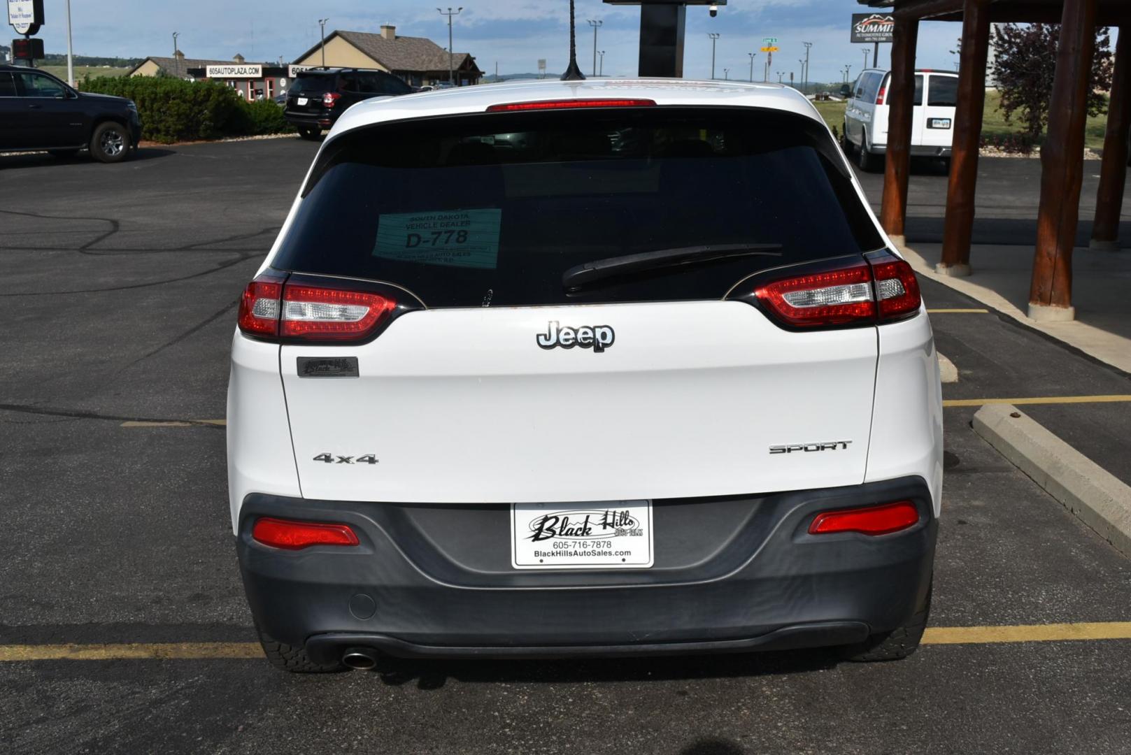 2016 White /Tan Jeep Cherokee Sport 4WD (1C4PJMAB2GW) with an 2.4L L4 DOHC 16V engine, 9-Speed Automatic transmission, located at 1600 E Hwy 44, Rapid City, SD, 57703, (605) 716-7878, 44.070232, -103.171410 - Photo#8