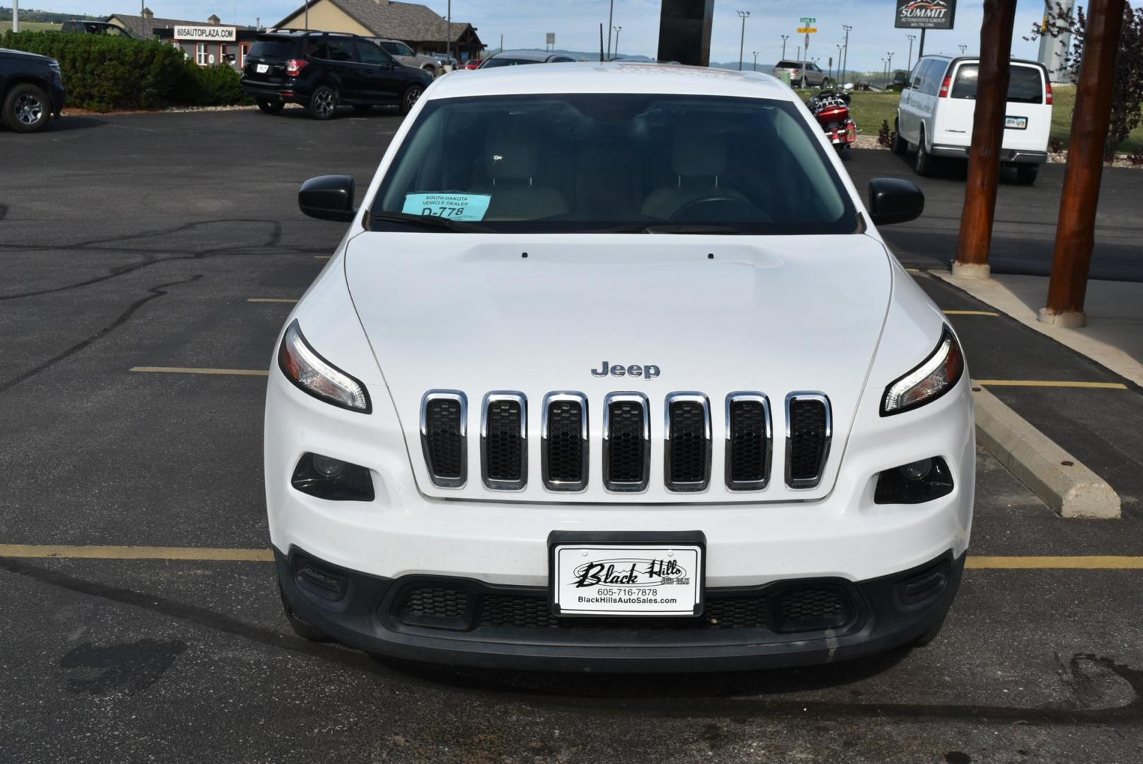 2016 White /Tan Jeep Cherokee Sport 4WD (1C4PJMAB2GW) with an 2.4L L4 DOHC 16V engine, 9-Speed Automatic transmission, located at 1600 E Hwy 44, Rapid City, SD, 57703, (605) 716-7878, 44.070232, -103.171410 - Photo#2