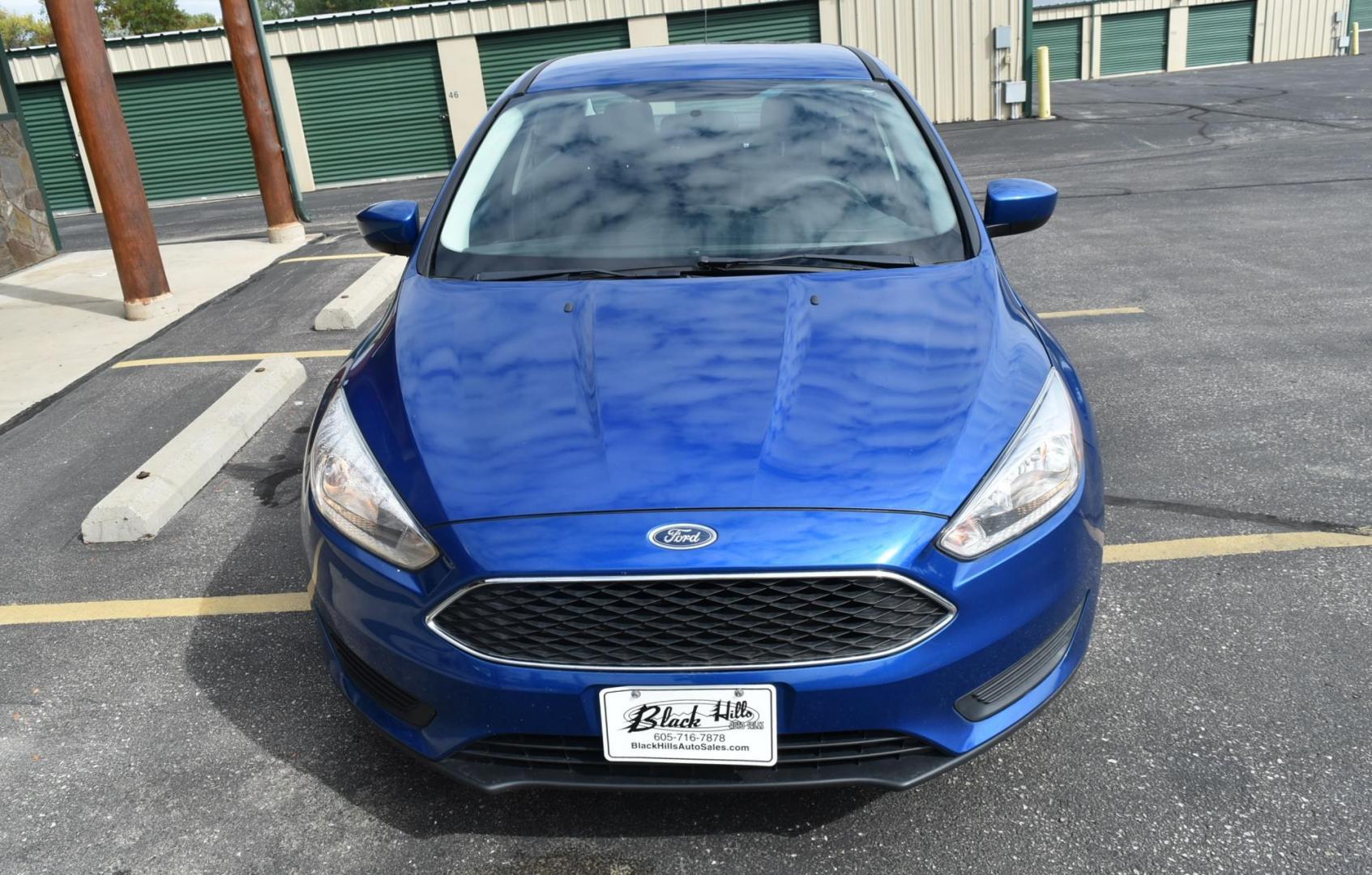 2018 Blue /Black Ford Focus SE (1FADP3F23JL) with an 2.0L L4 DOHC 16V engine, 6-Speed Automatic transmission, located at 1600 E Hwy 44, Rapid City, SD, 57703, (605) 716-7878, 44.070232, -103.171410 - Photo#2