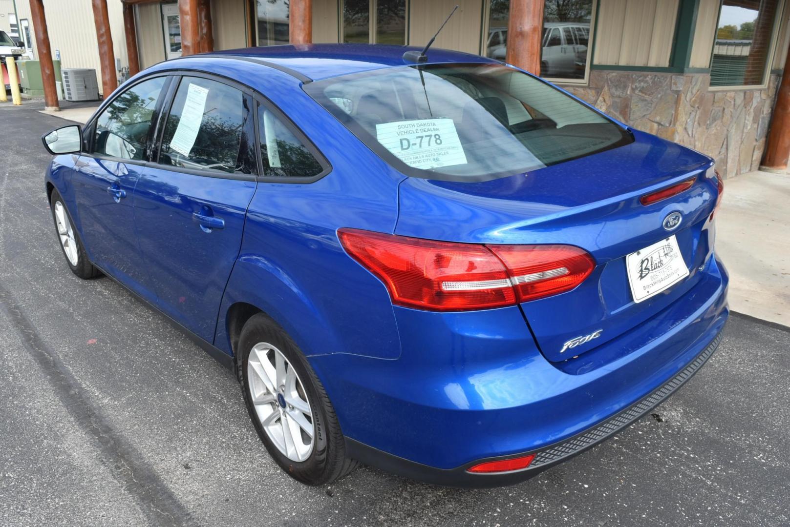 2018 Blue /Black Ford Focus SE (1FADP3F23JL) with an 2.0L L4 DOHC 16V engine, 6-Speed Automatic transmission, located at 1600 E Hwy 44, Rapid City, SD, 57703, (605) 716-7878, 44.070232, -103.171410 - Photo#6