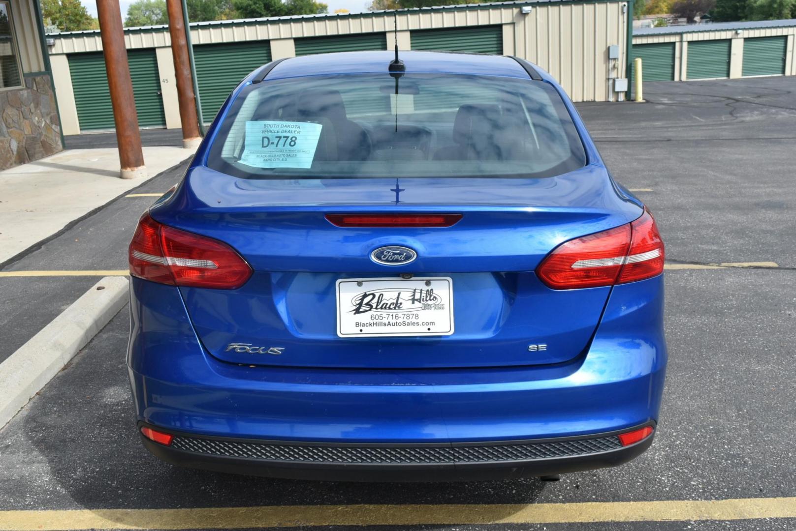 2018 Blue /Black Ford Focus SE (1FADP3F23JL) with an 2.0L L4 DOHC 16V engine, 6-Speed Automatic transmission, located at 1600 E Hwy 44, Rapid City, SD, 57703, (605) 716-7878, 44.070232, -103.171410 - Photo#7