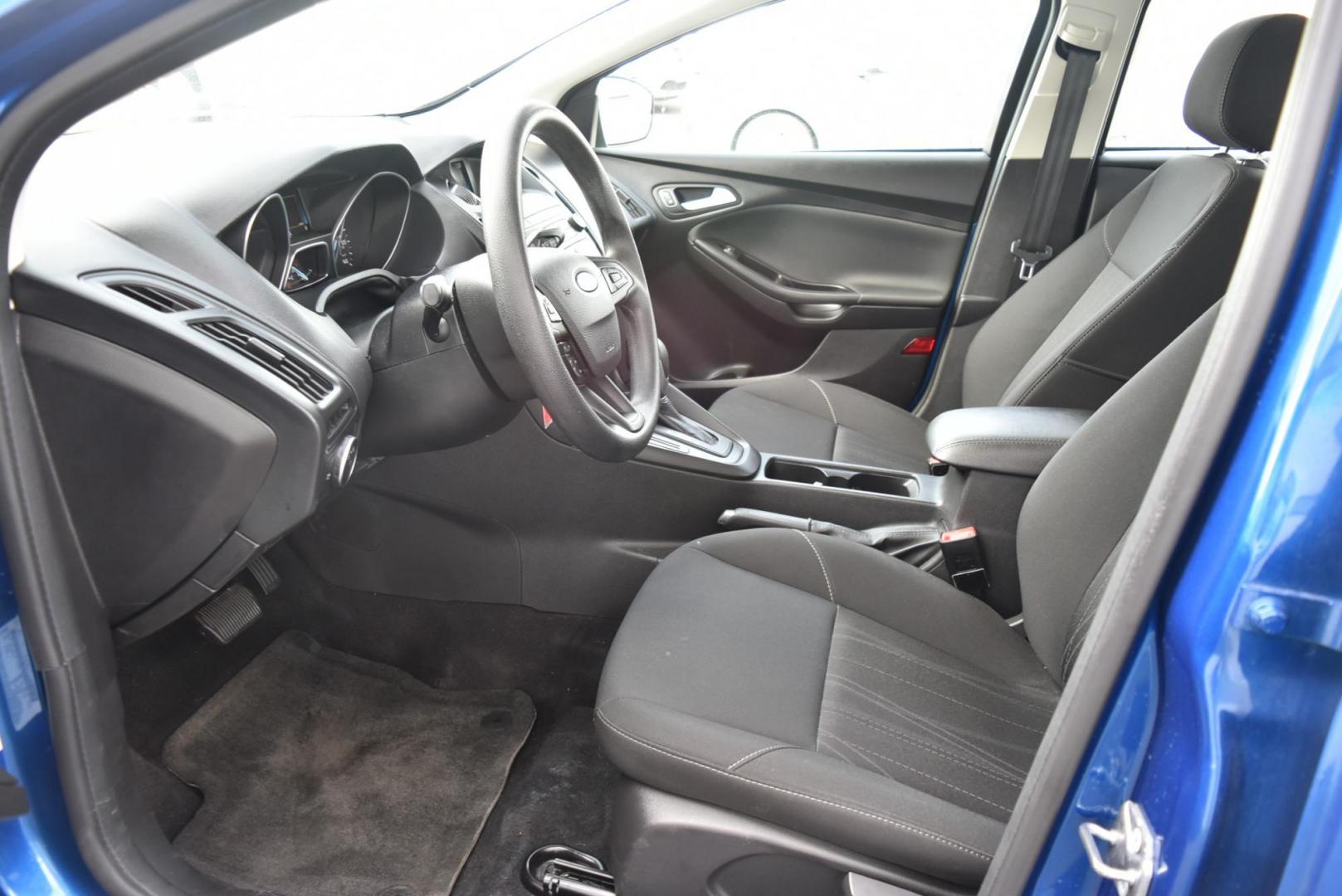 2018 Blue /Black Ford Focus SE (1FADP3F23JL) with an 2.0L L4 DOHC 16V engine, 6-Speed Automatic transmission, located at 1600 E Hwy 44, Rapid City, SD, 57703, (605) 716-7878, 44.070232, -103.171410 - Photo#9