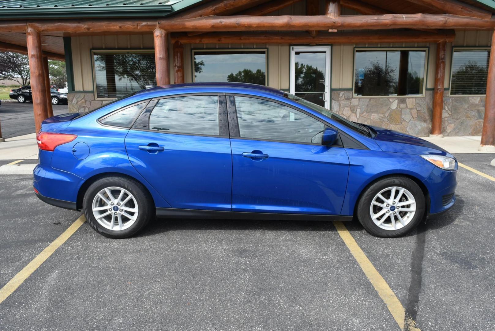 2018 Blue /Black Ford Focus SE (1FADP3F23JL) with an 2.0L L4 DOHC 16V engine, 6-Speed Automatic transmission, located at 1600 E Hwy 44, Rapid City, SD, 57703, (605) 716-7878, 44.070232, -103.171410 - Photo#5