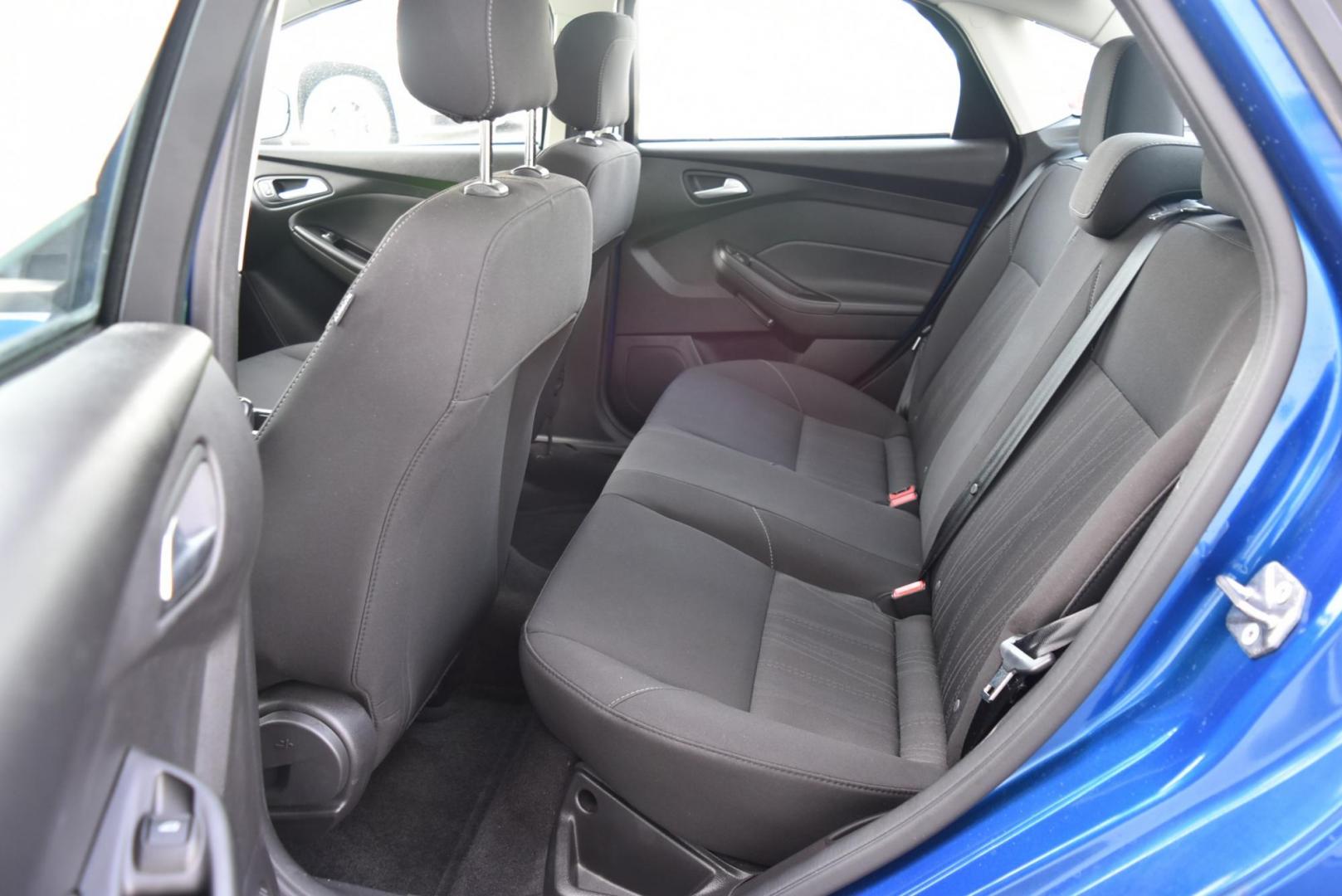 2018 Blue /Black Ford Focus SE (1FADP3F23JL) with an 2.0L L4 DOHC 16V engine, 6-Speed Automatic transmission, located at 1600 E Hwy 44, Rapid City, SD, 57703, (605) 716-7878, 44.070232, -103.171410 - Photo#12