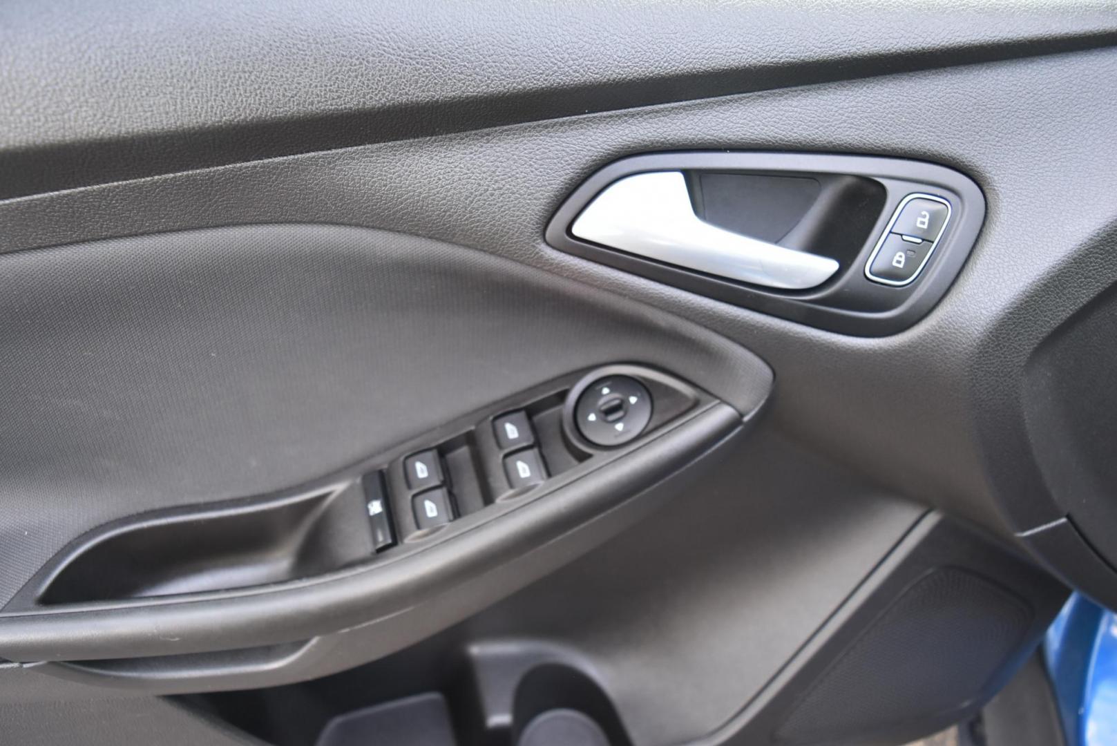 2018 Blue /Black Ford Focus SE (1FADP3F23JL) with an 2.0L L4 DOHC 16V engine, 6-Speed Automatic transmission, located at 1600 E Hwy 44, Rapid City, SD, 57703, (605) 716-7878, 44.070232, -103.171410 - Photo#14